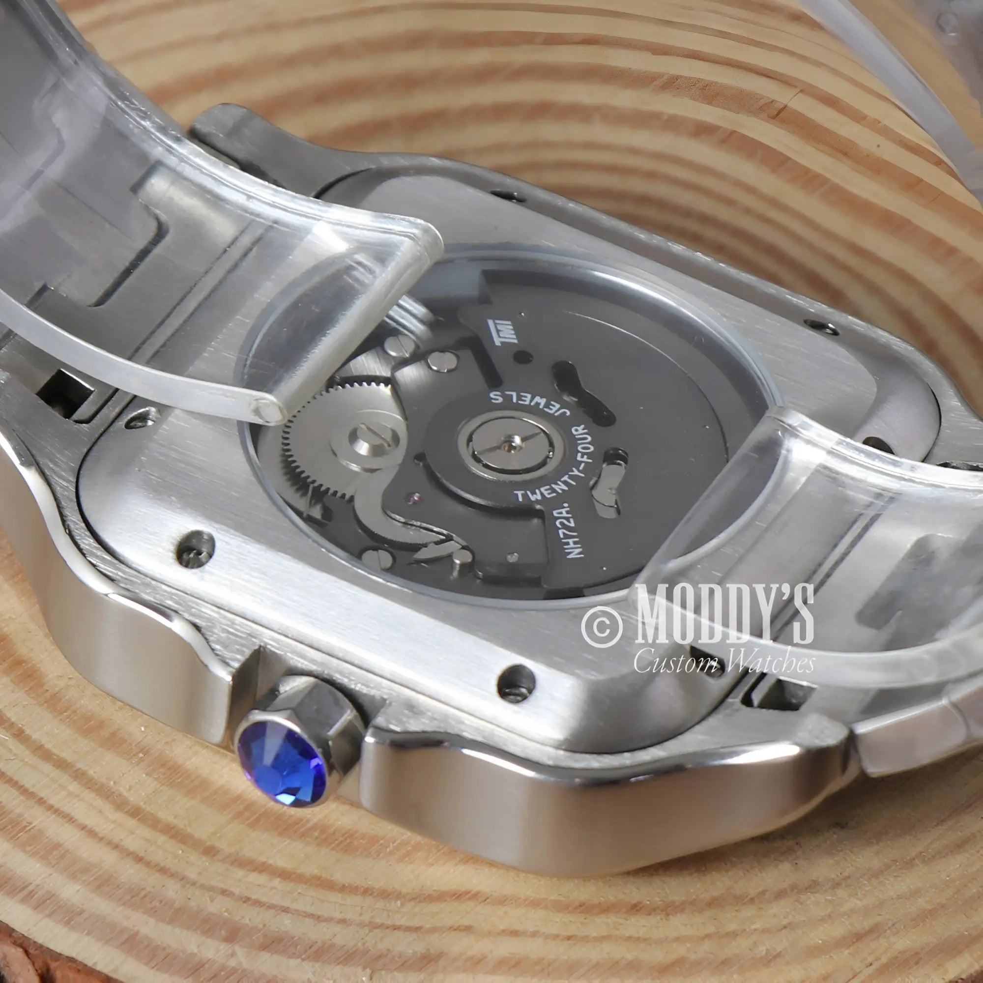 Silver-toned watch back with Seiko VK64 movement, sapphire crown