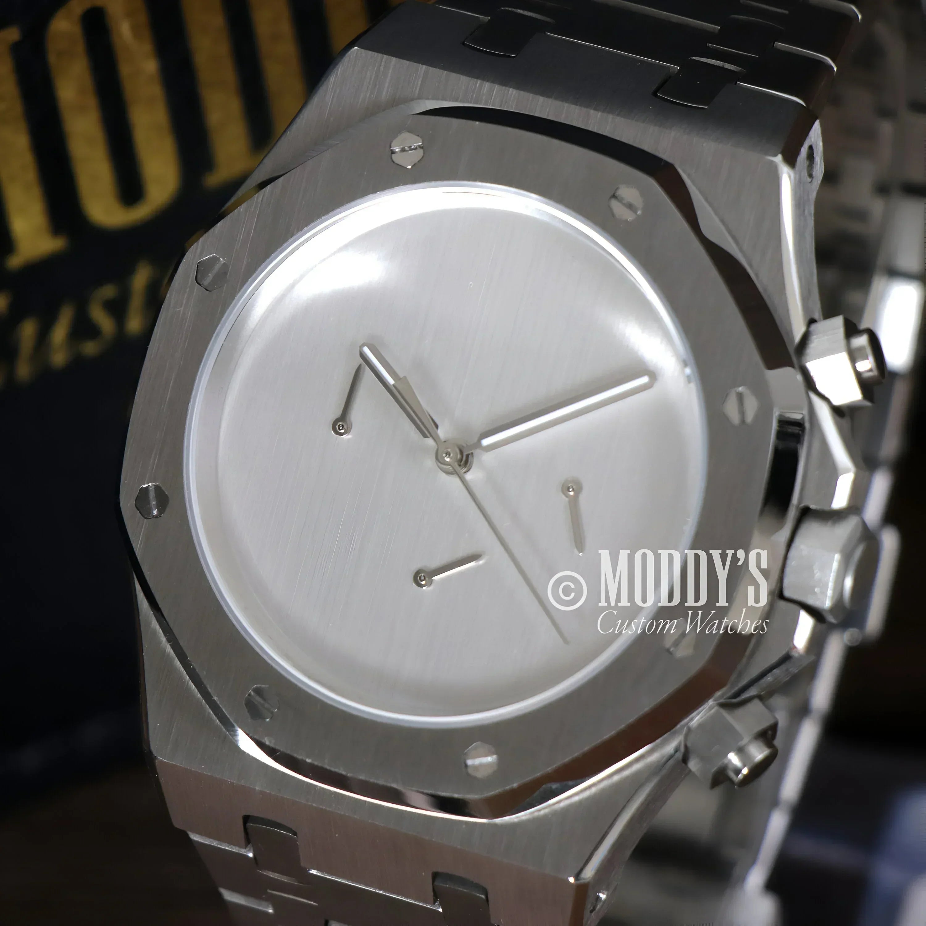 Silver wristwatch with minimalist face, Royal Seikoak features VK63 hybrid movement