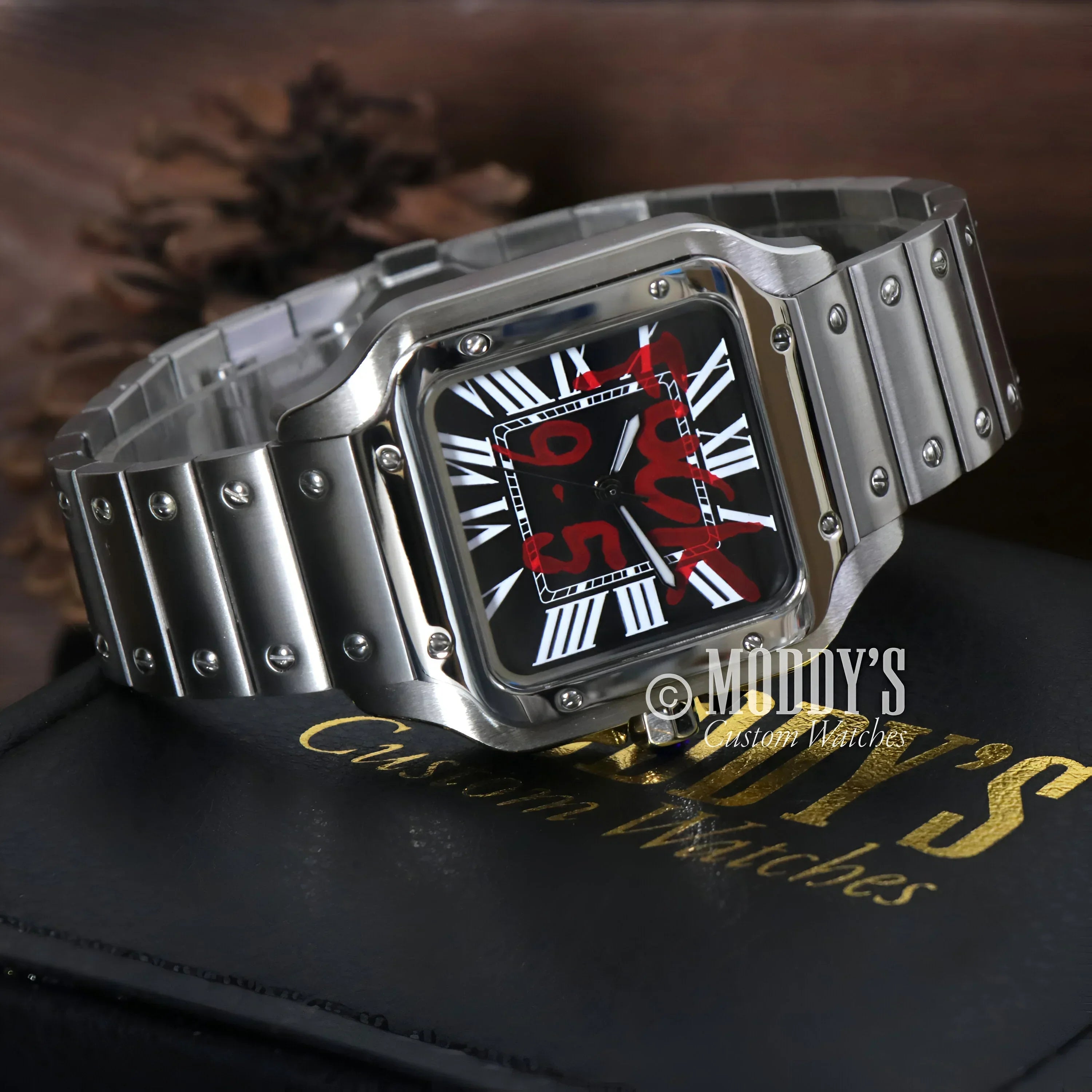 Silver wristwatch with red markings, featuring a Seiko NH35 automatic movement