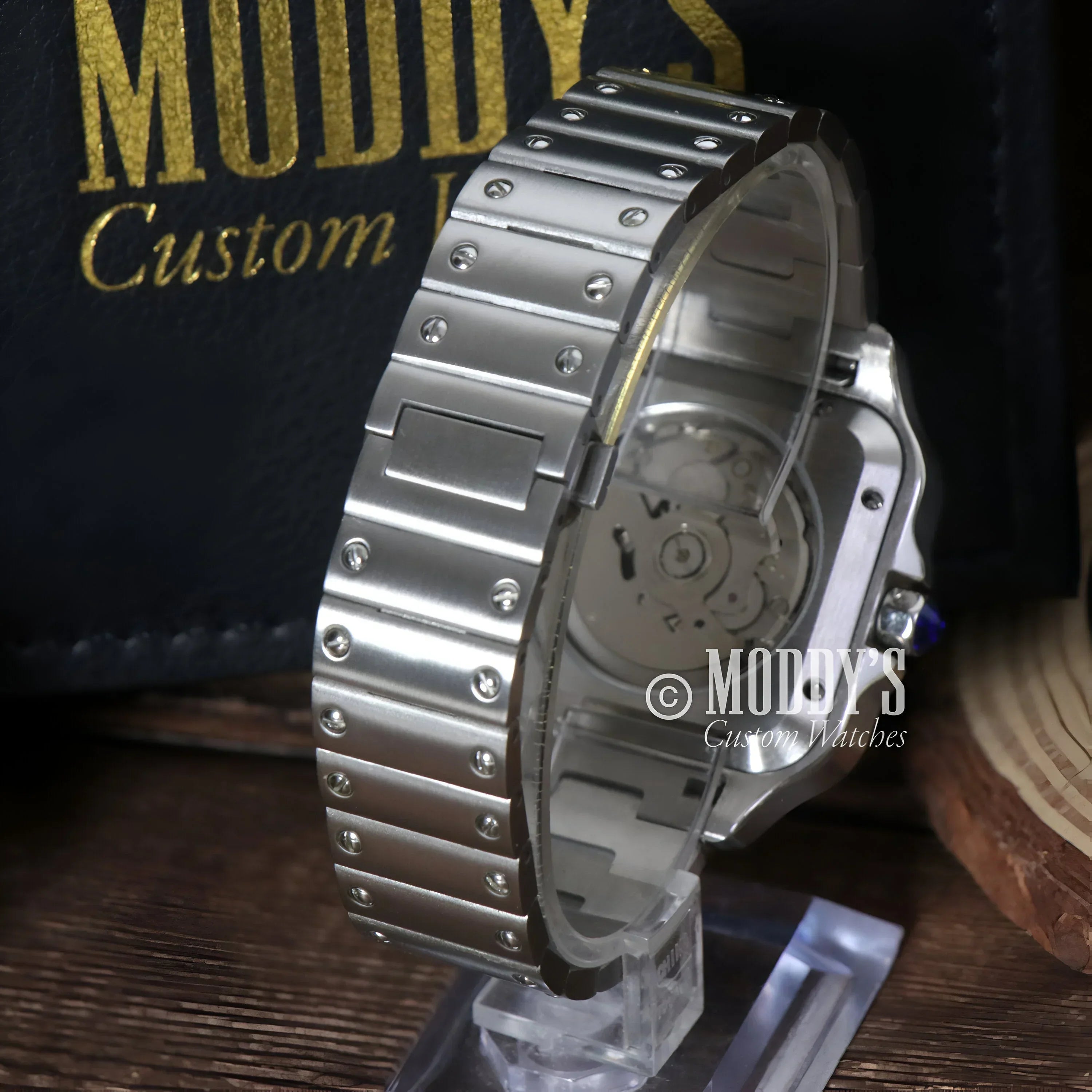 Silver wristwatch with exposed mechanism from Santeiko, featuring Seiko NH35 Automatic