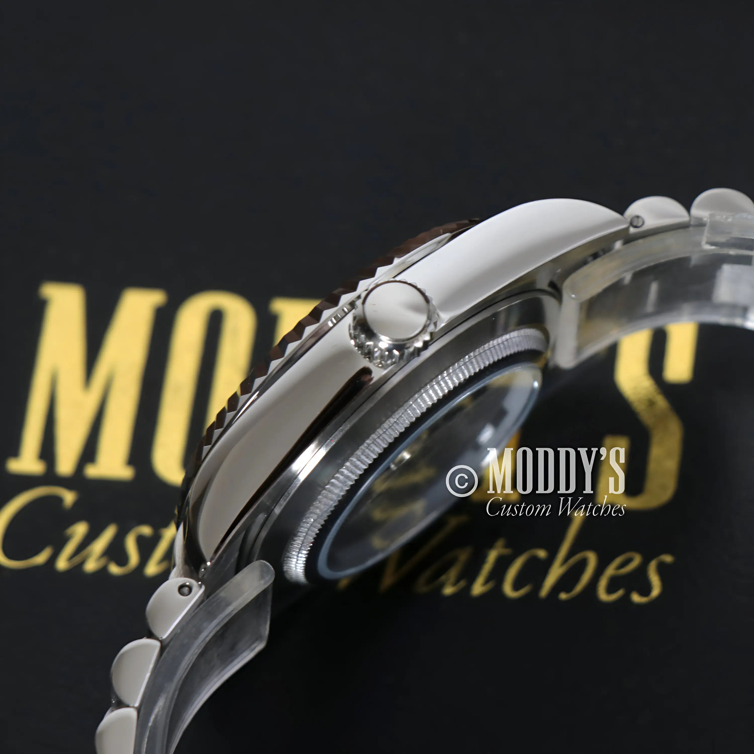 Seiko mod watch with black dial, red accents, 316L stainless steel bracelet