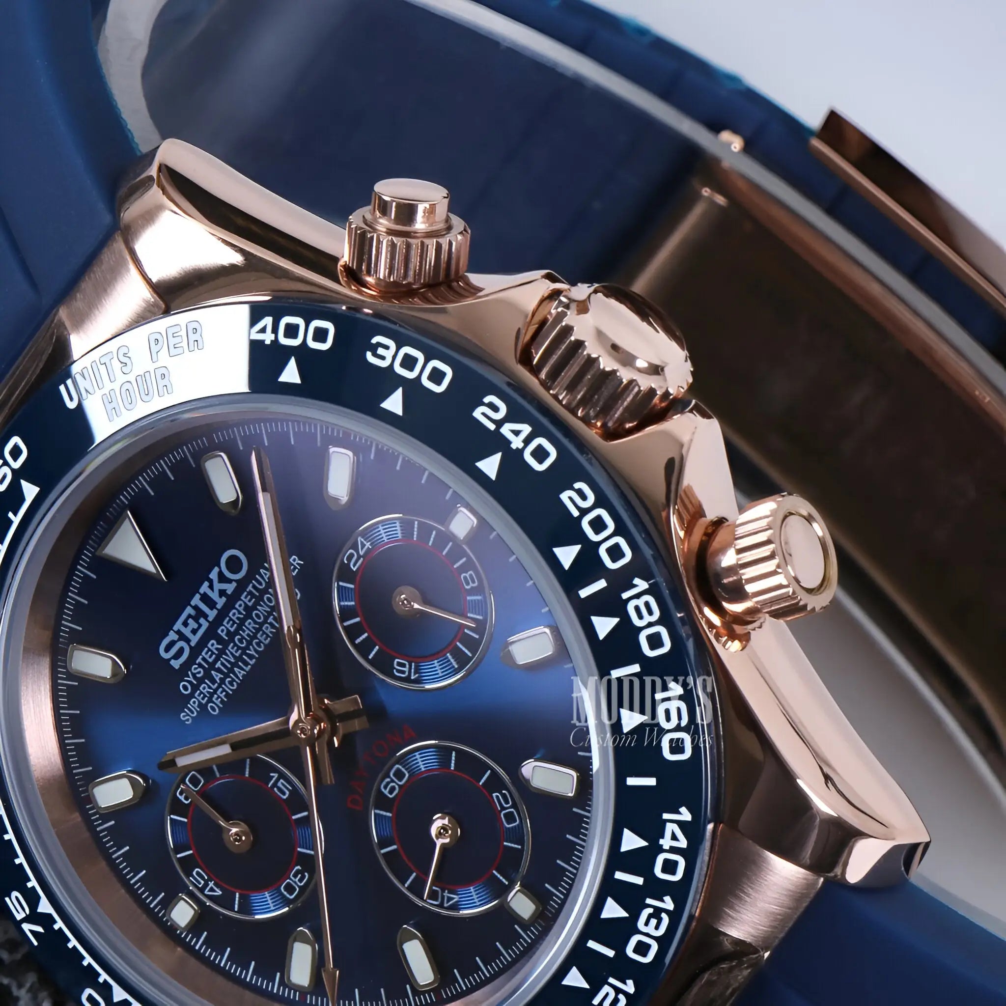 Rose gold Seiko VK63 hybrid chronograph with blue dial, bezel, stainless steel case