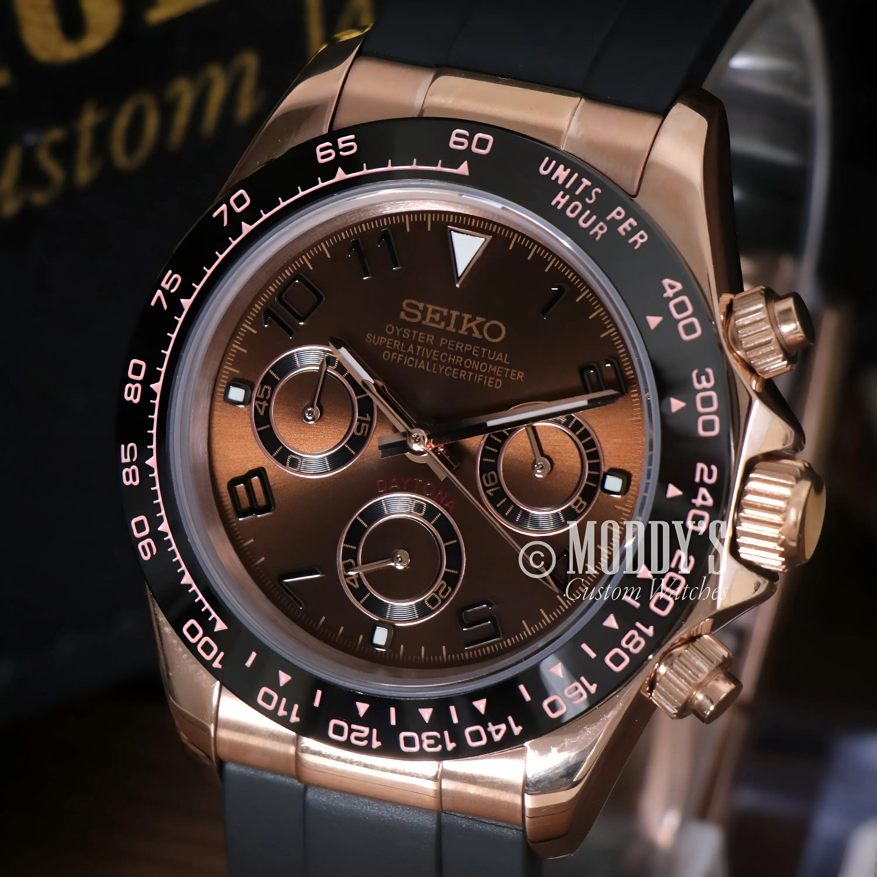 Rose gold Seiko VK63 hybrid chronograph watch with brown dial, black bezel, rubber strap