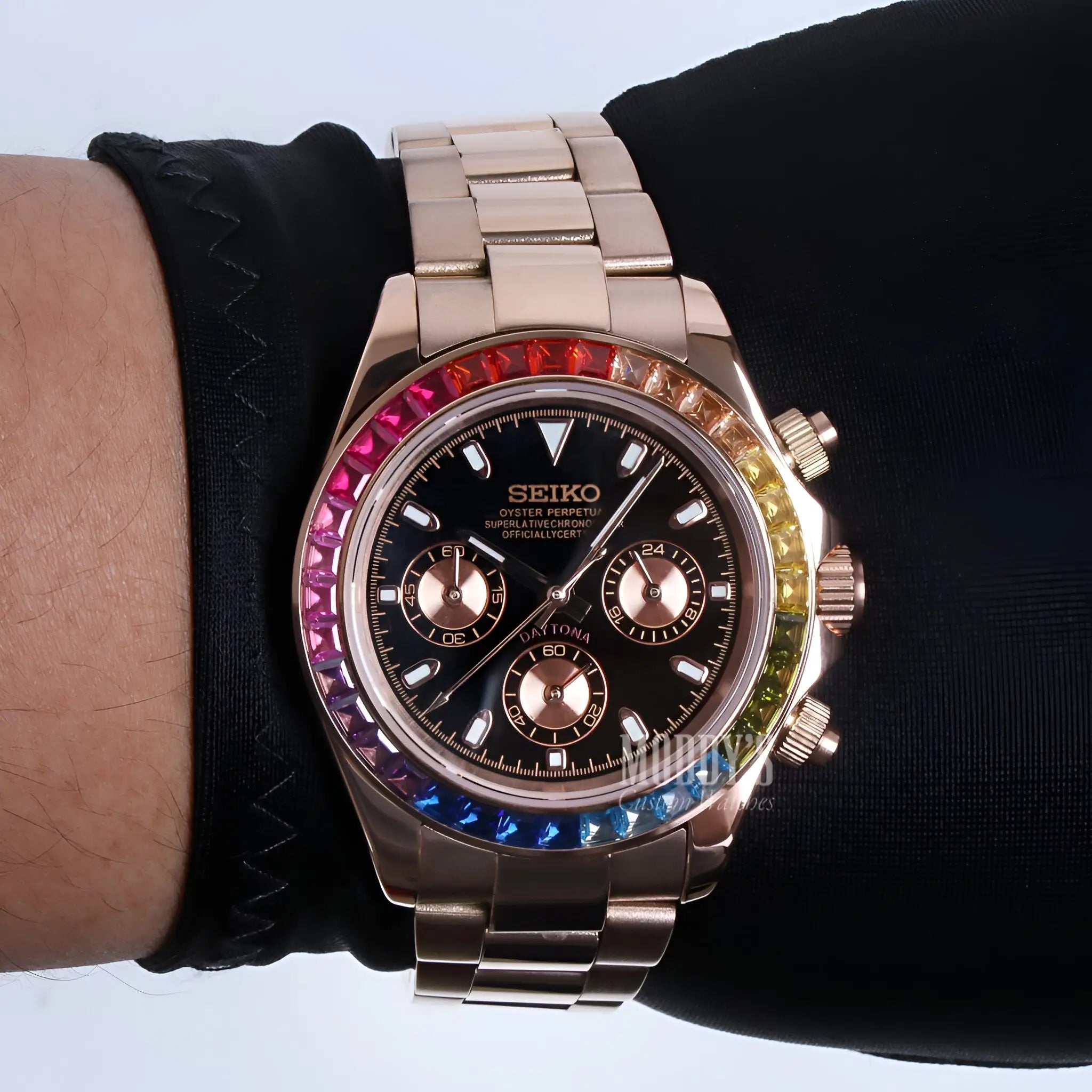 Rose gold Seiko chronograph watch with black dial and rainbow bezel, Seitona model featuring VK63 hybrid movement