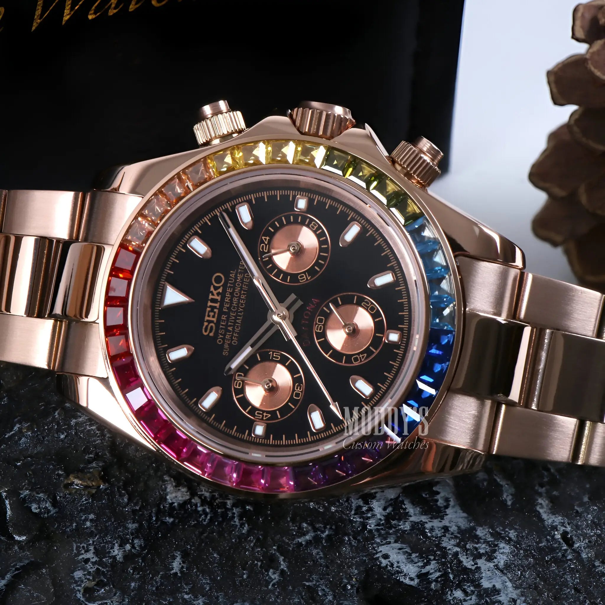Rose gold Seiko VK63 hybrid chronograph with rainbow bezel and black dial