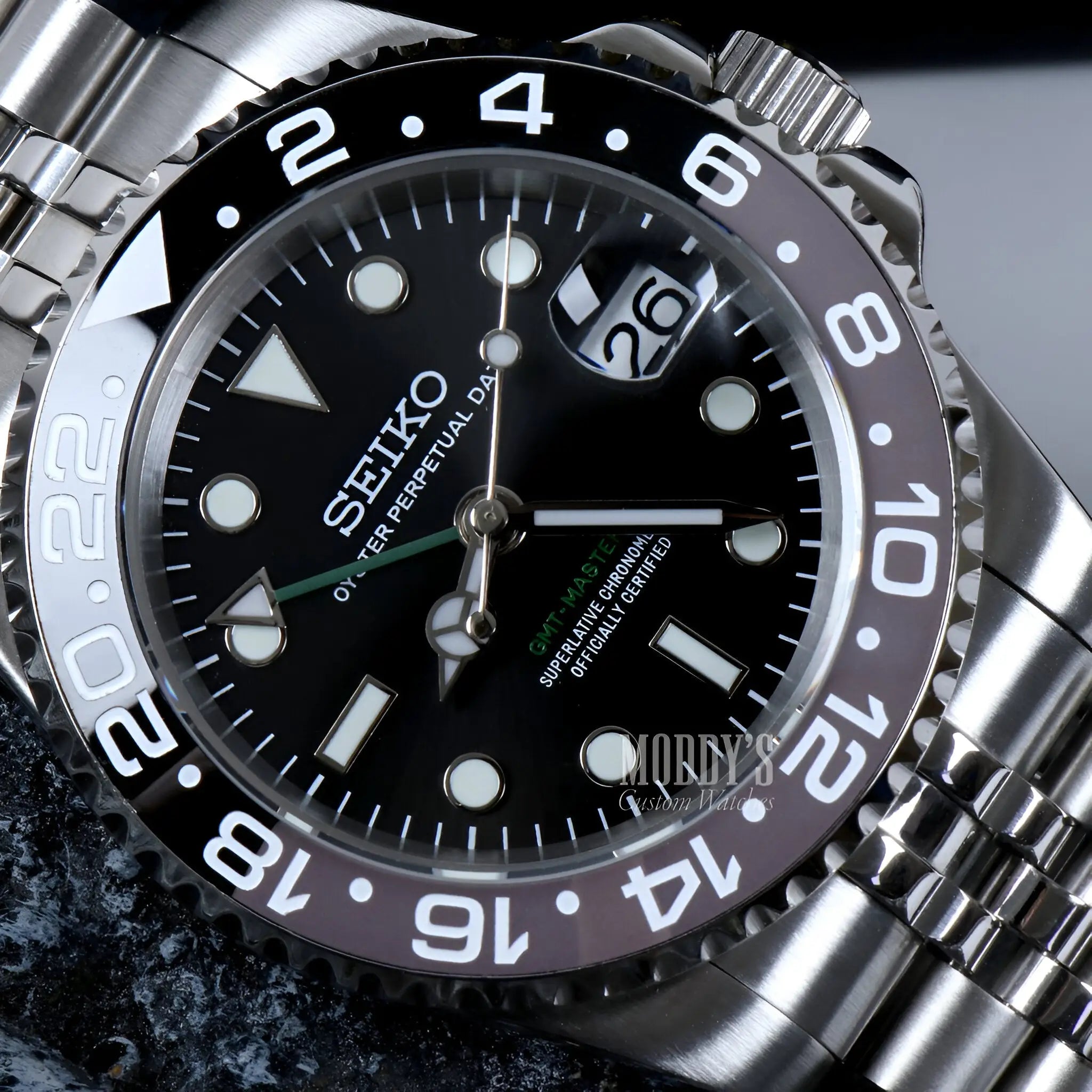Seiko NH34 automatic mod GMT watch with black dial and green hands