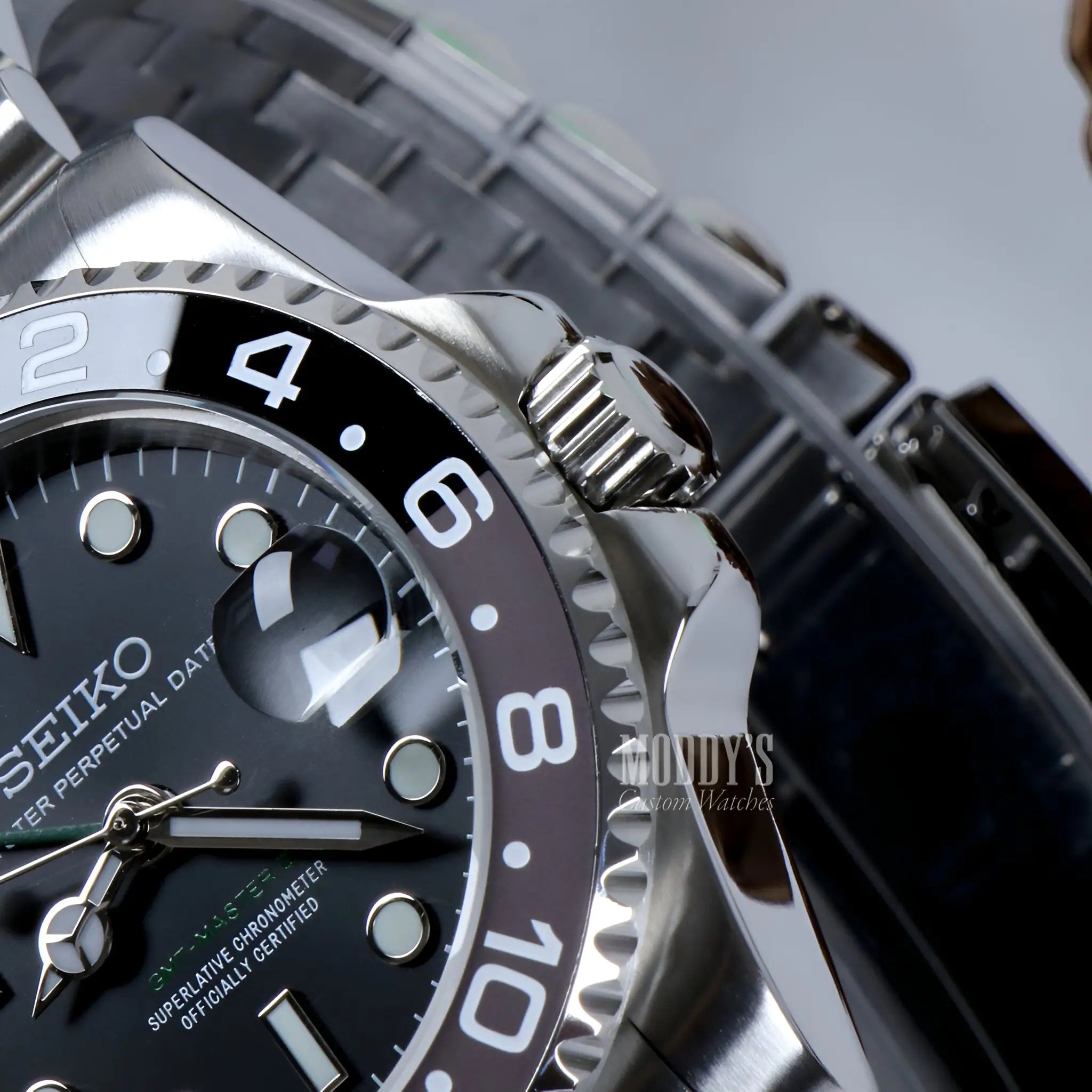 Seiko NH34 automatic mod GMT watch with black dial and silver bezel