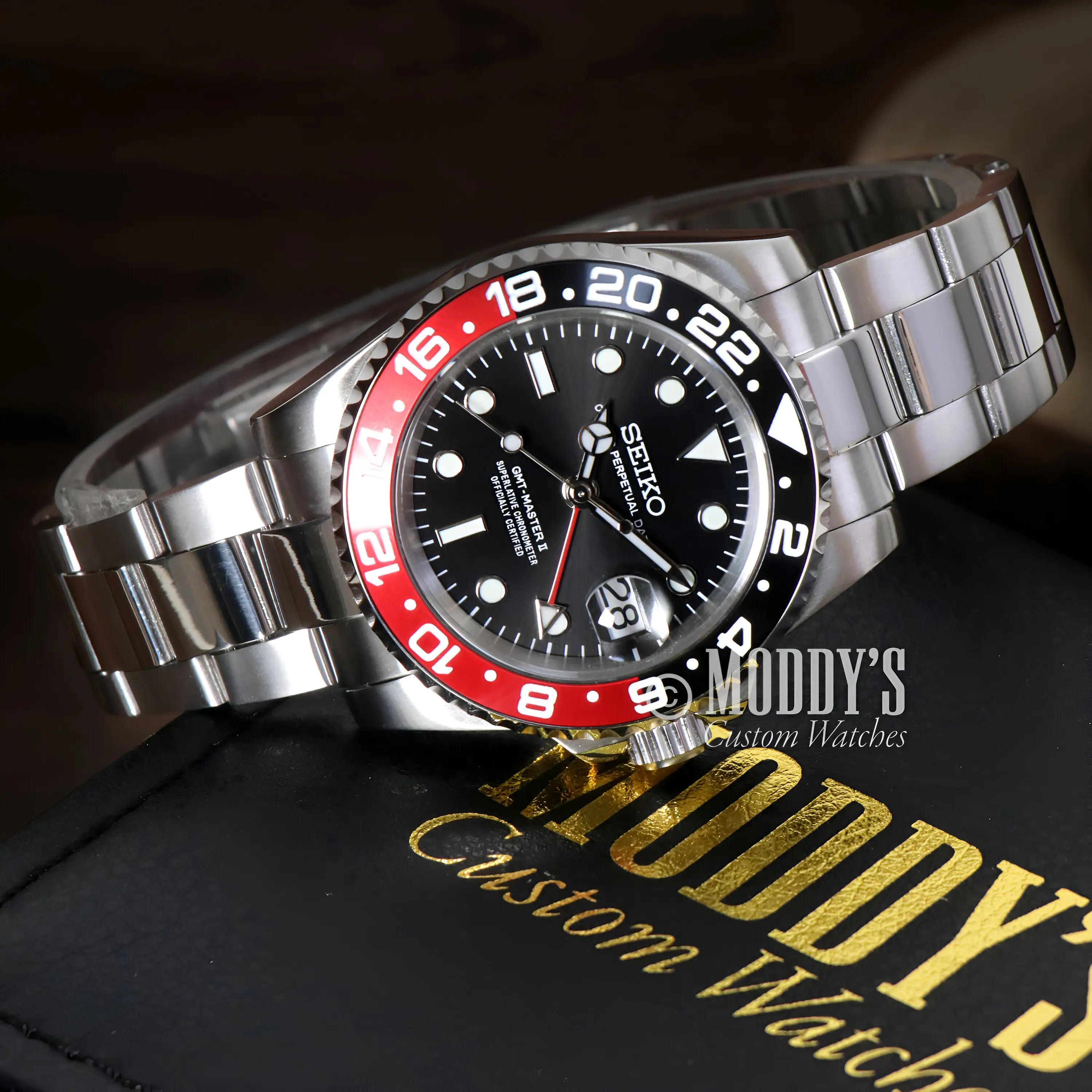 Seiko NH34 automatic GMT watch with black dial, red blue bezel, stainless steel mod