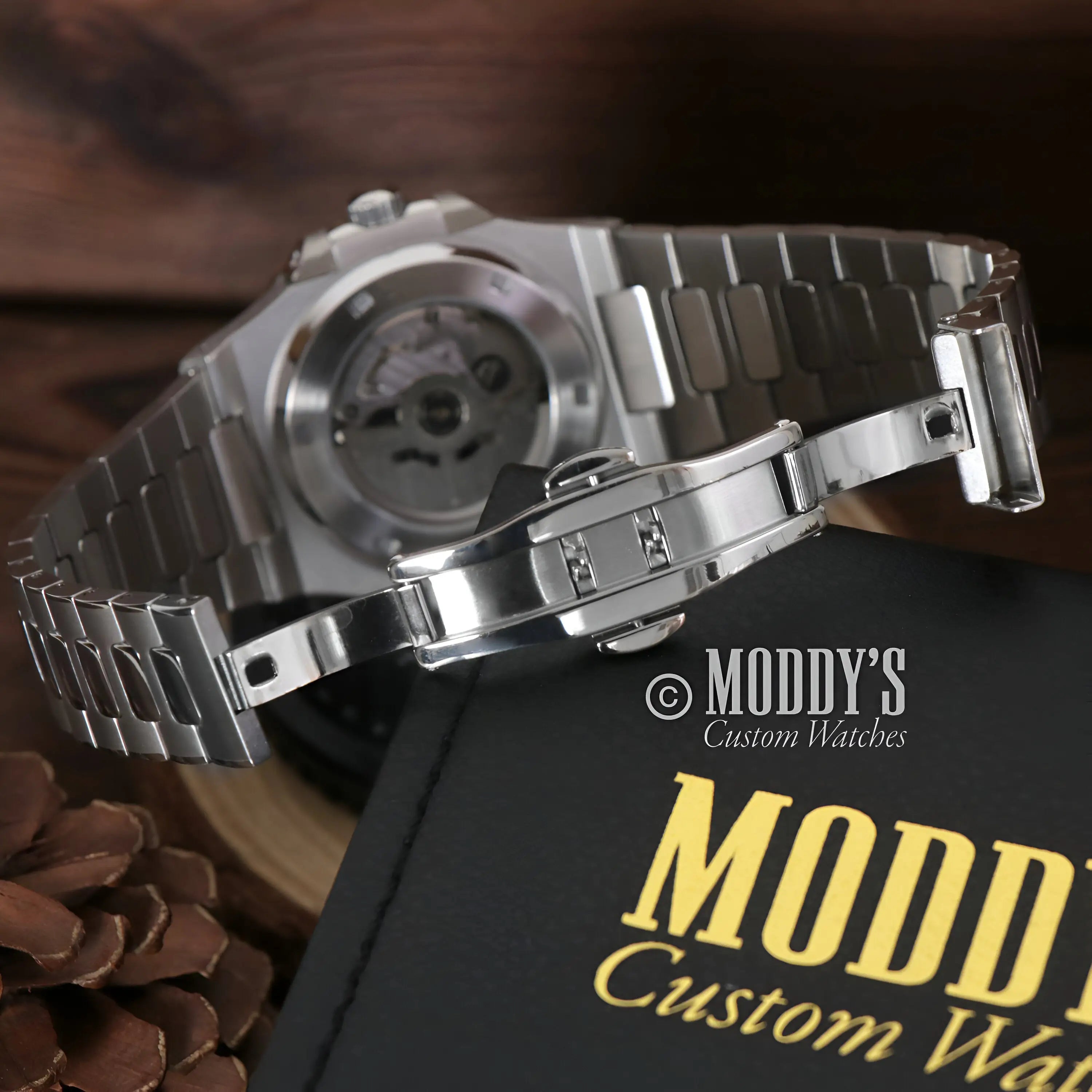 Sleek silver Seiko NH35 automatic Nautilus mod watch in brown