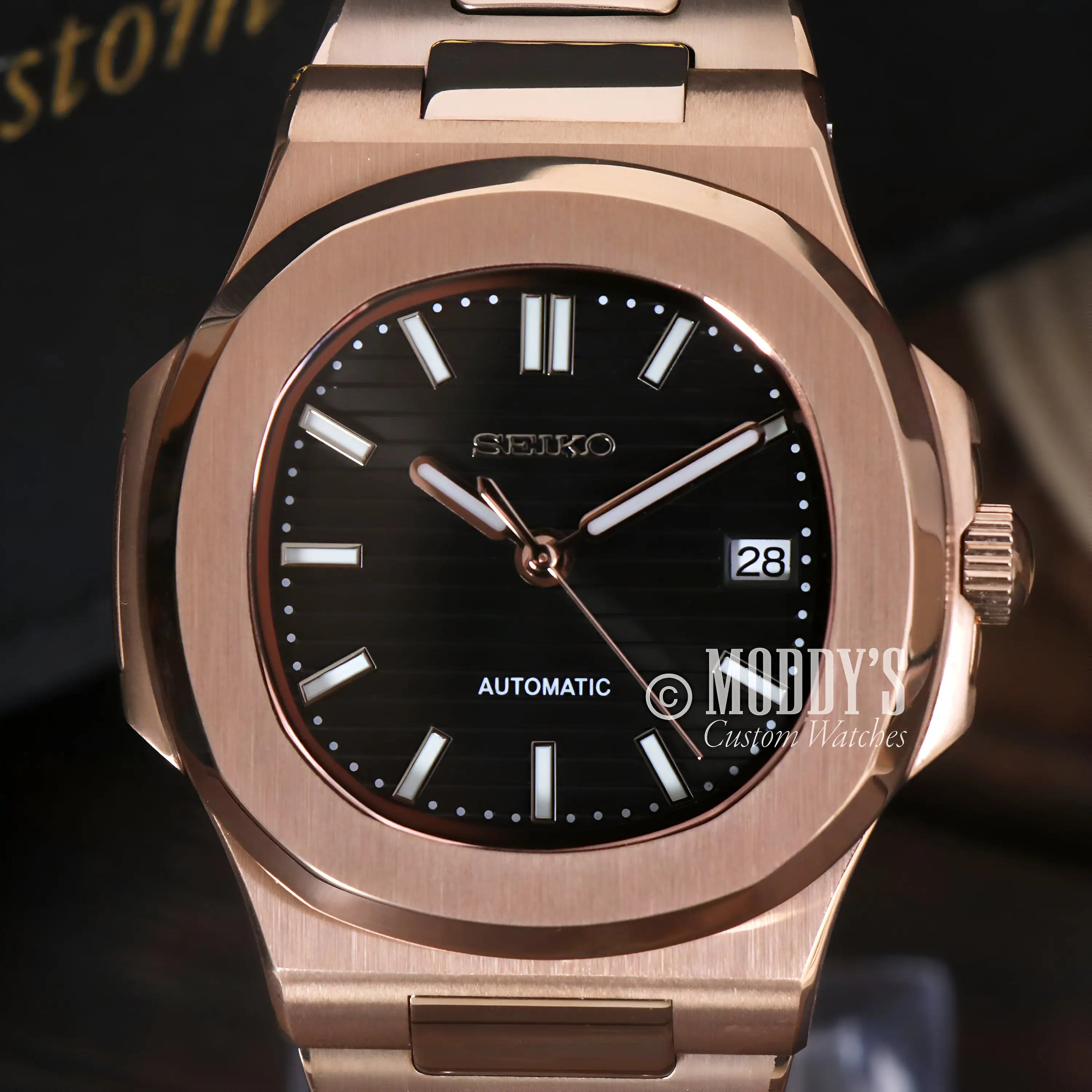 Rose gold Seiko mod Nautilus watch with black dial and NH35 automatic movement