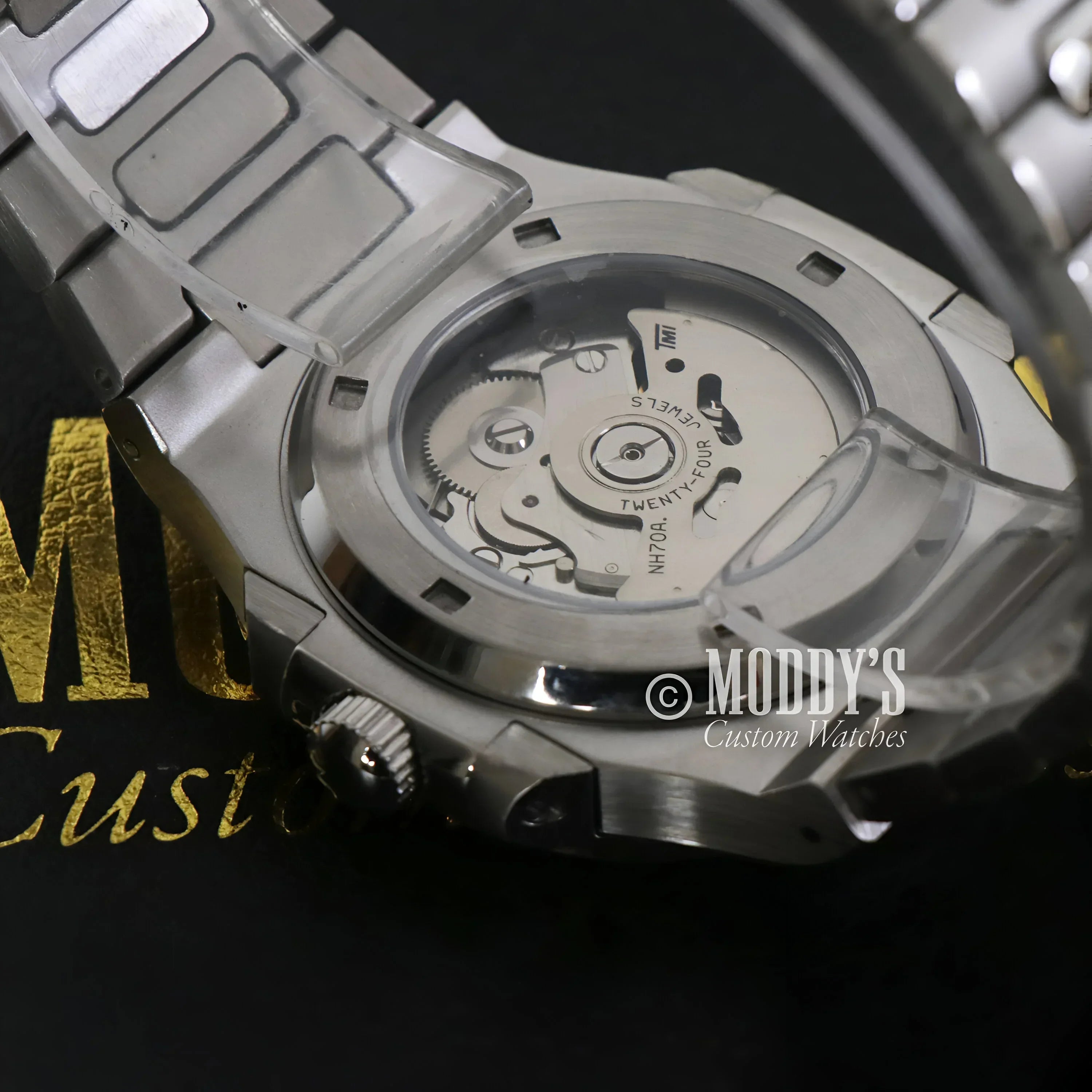 Silver Nautiko Skeleton wristwatch showcasing NH70 automatic movement elegance