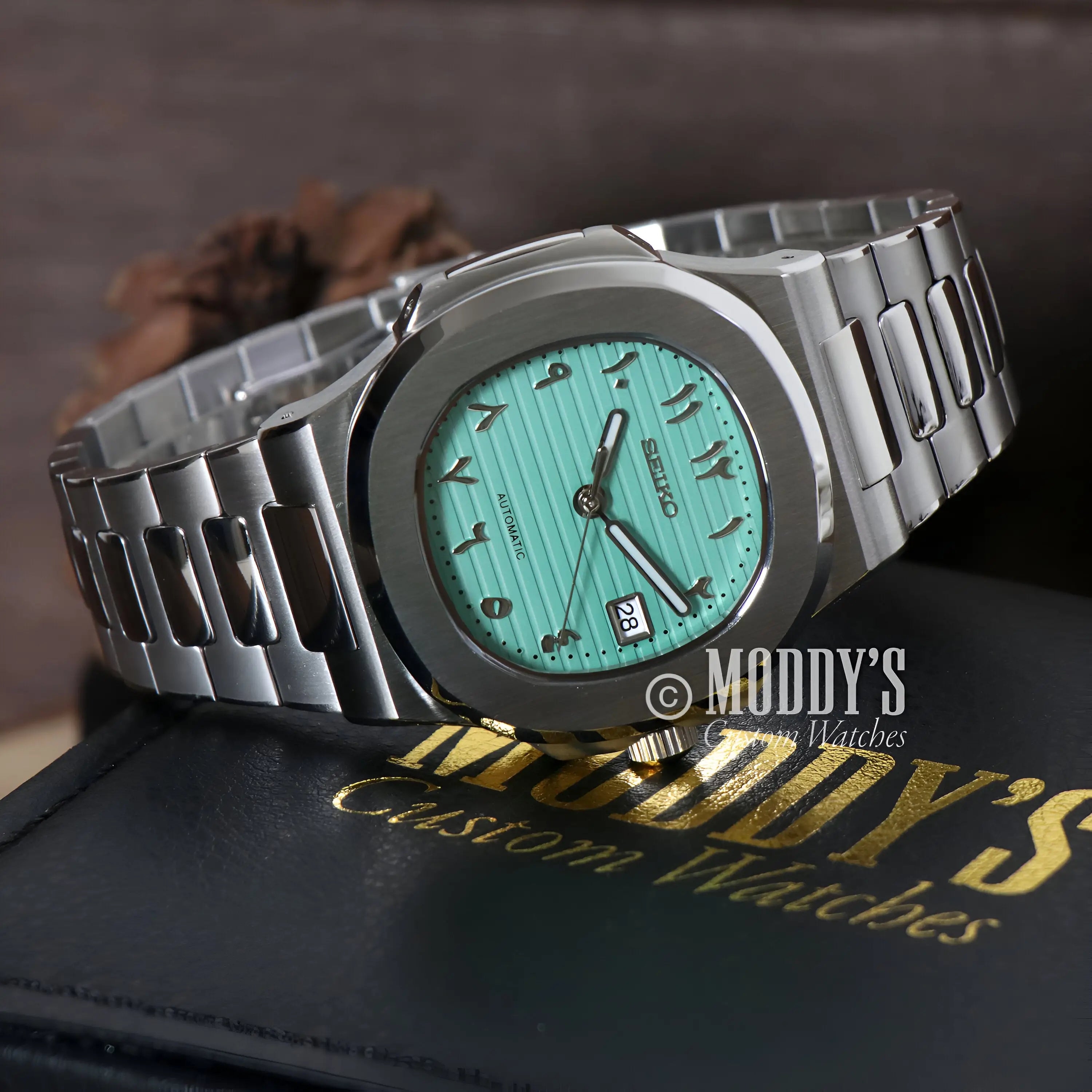 Mint green Seiko mod Nautilus watch with 904L stainless steel band