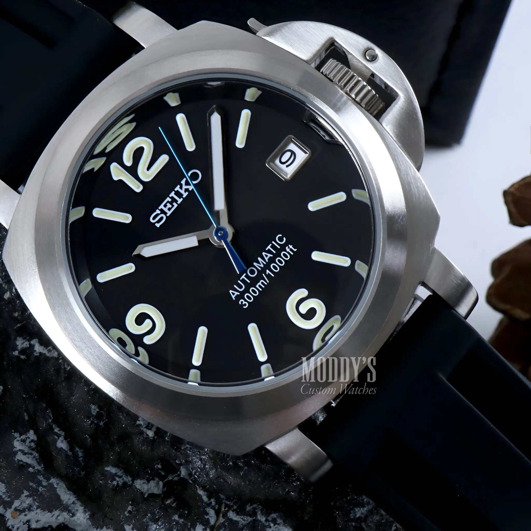 Seiko NH35 automatic black dial watch with silver accents and date window