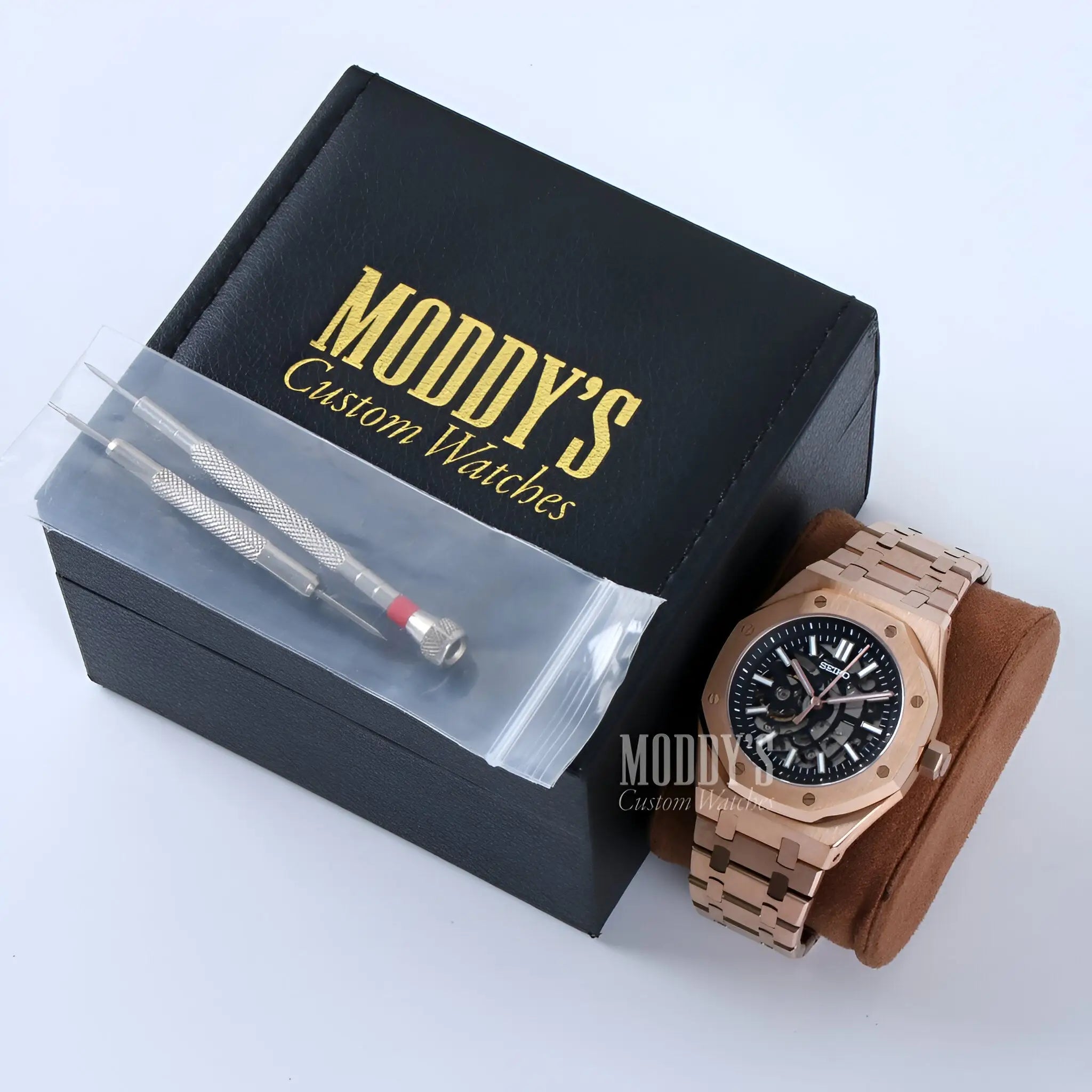 Rose gold Audemars Piguet Royal Oak mod watch with black dial and Roman numerals