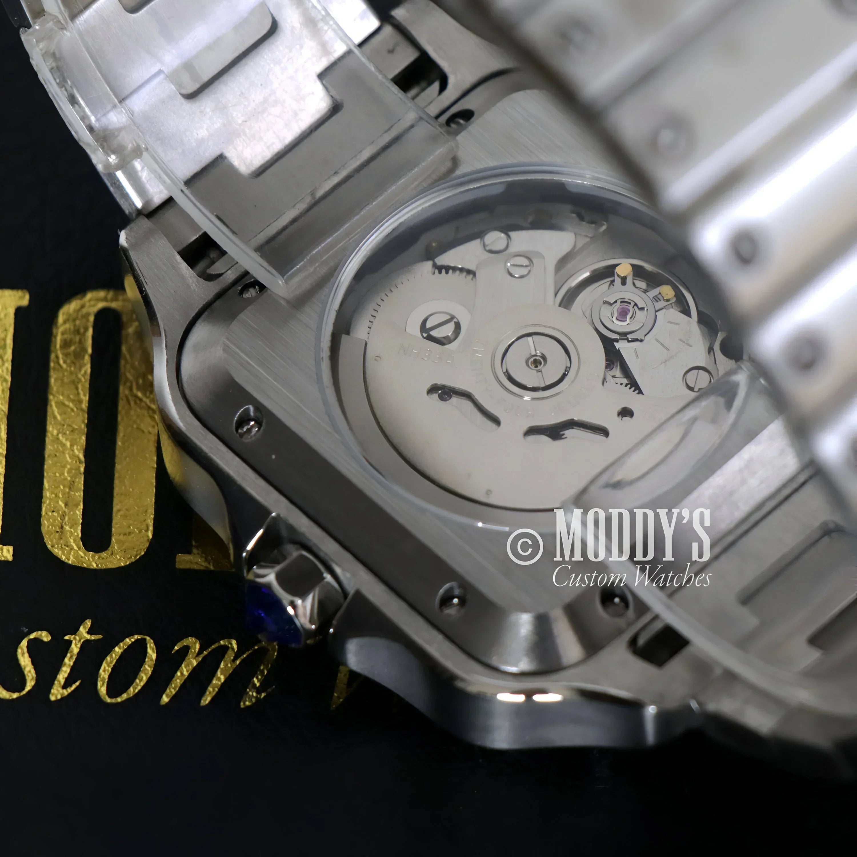 Silver wristwatch Santeiko Arabic Fck 9 to 5 with NH35 automatic movement showcased