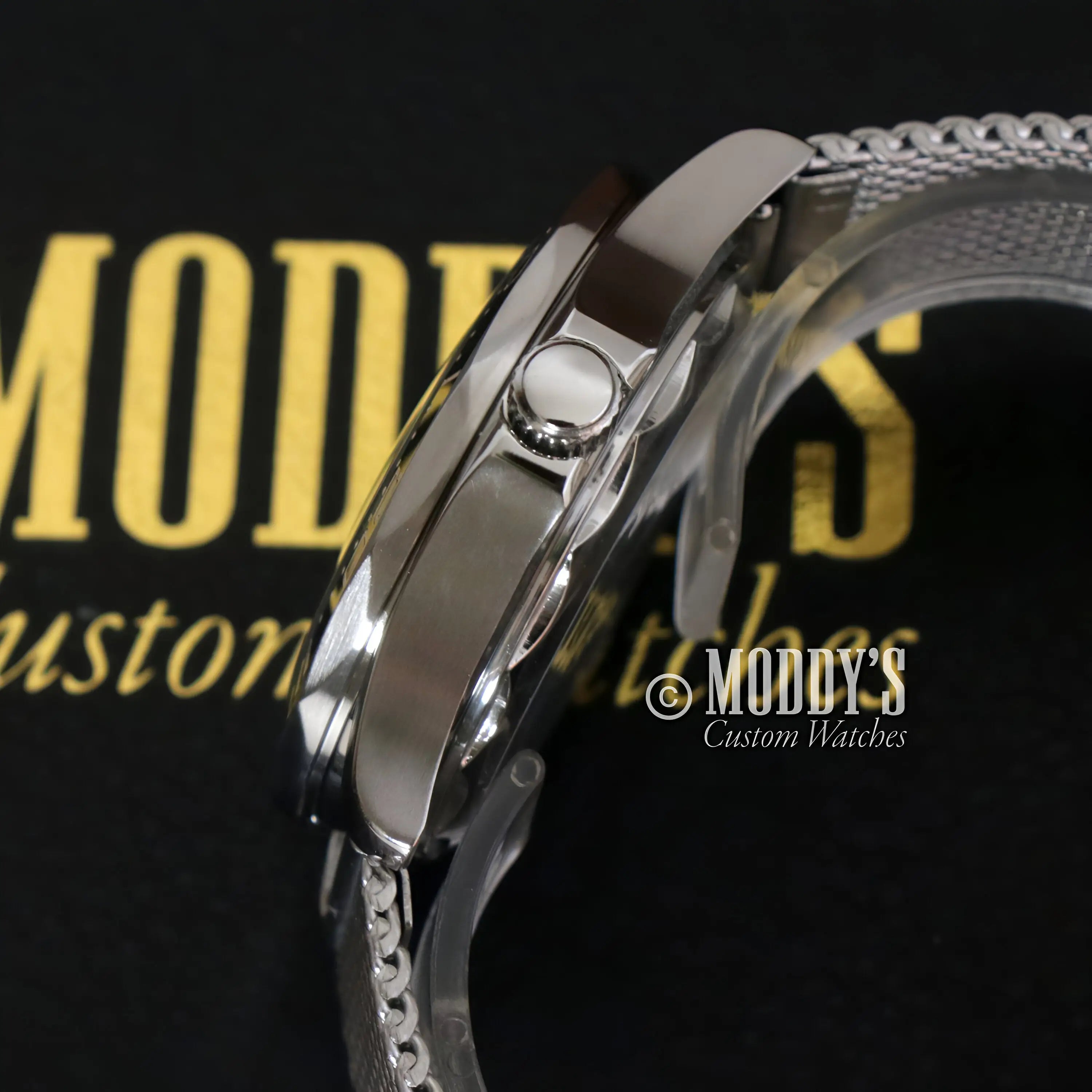 Seiko mod Seamaster watch with silver stainless steel case, textured strap, and push button crown