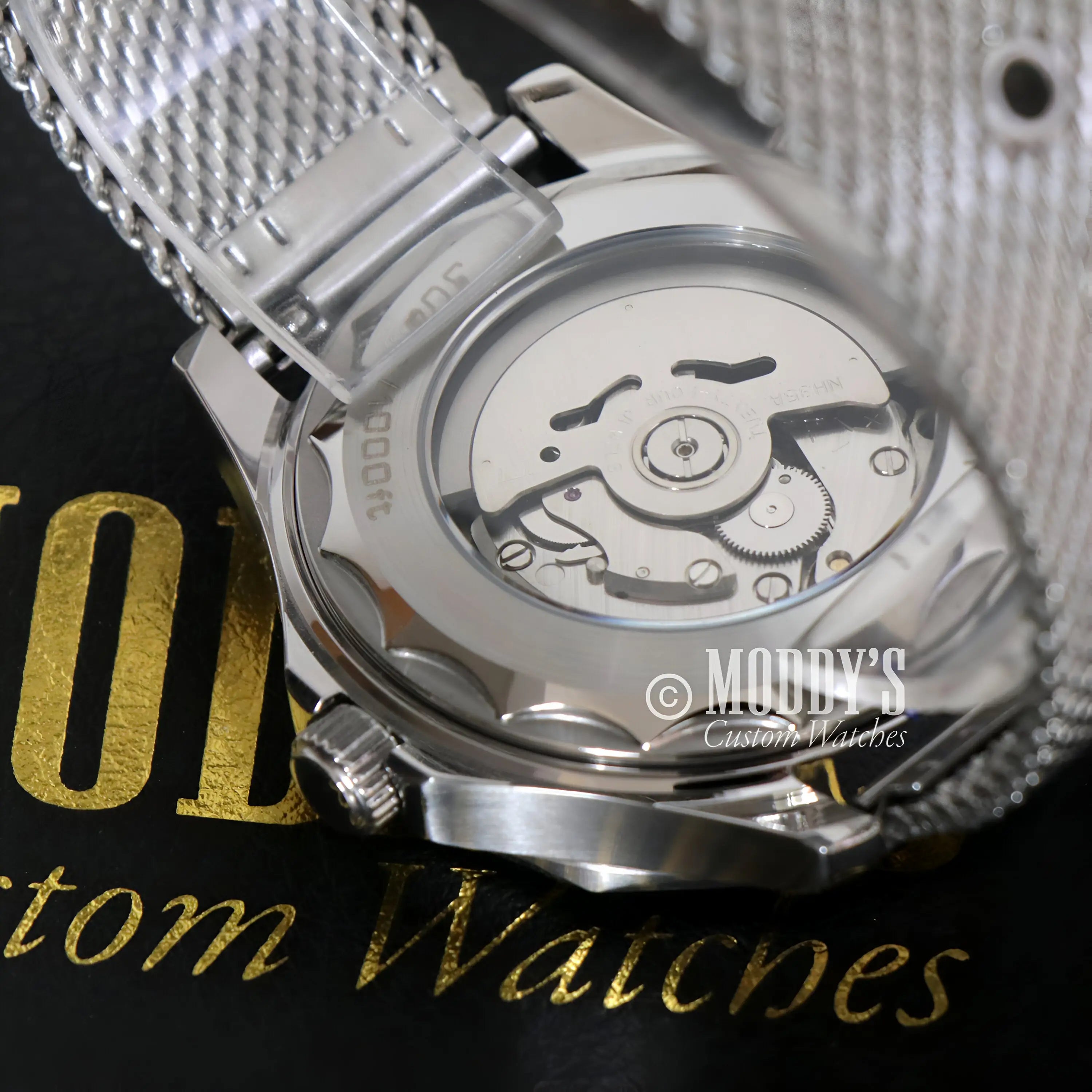 Seiko NH35 automatic Seikomaster James Bond 007 watch with silver mesh and gold accents