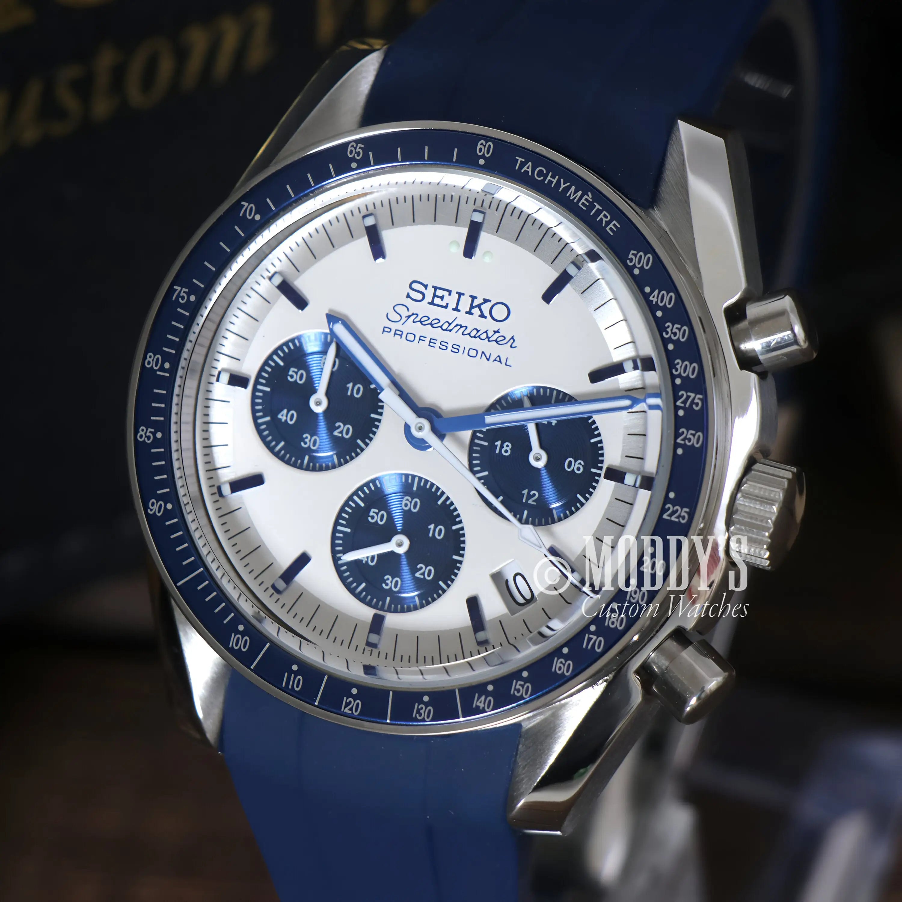 Seiko mod Speedmaster chronograph watch with blue rubber strap and silver case