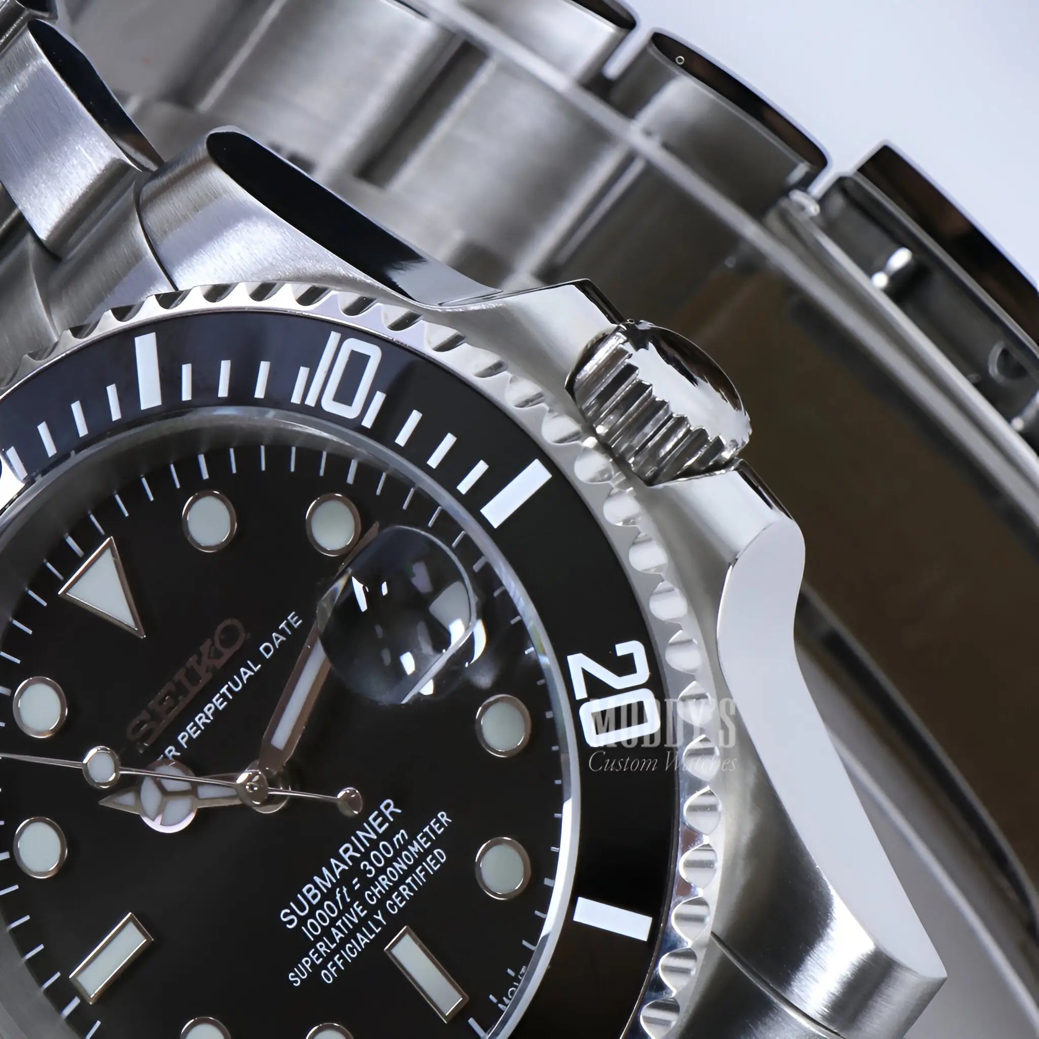 Seiko mod Submariner watch with black dial and silver steel bracelet