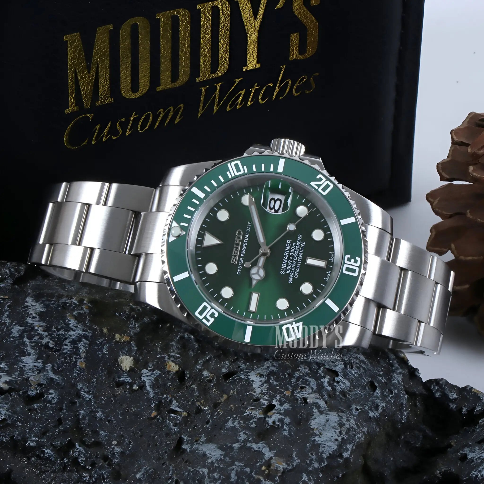 Green and silver Seiko NH35 automatic diver watch with iconic Submariner design