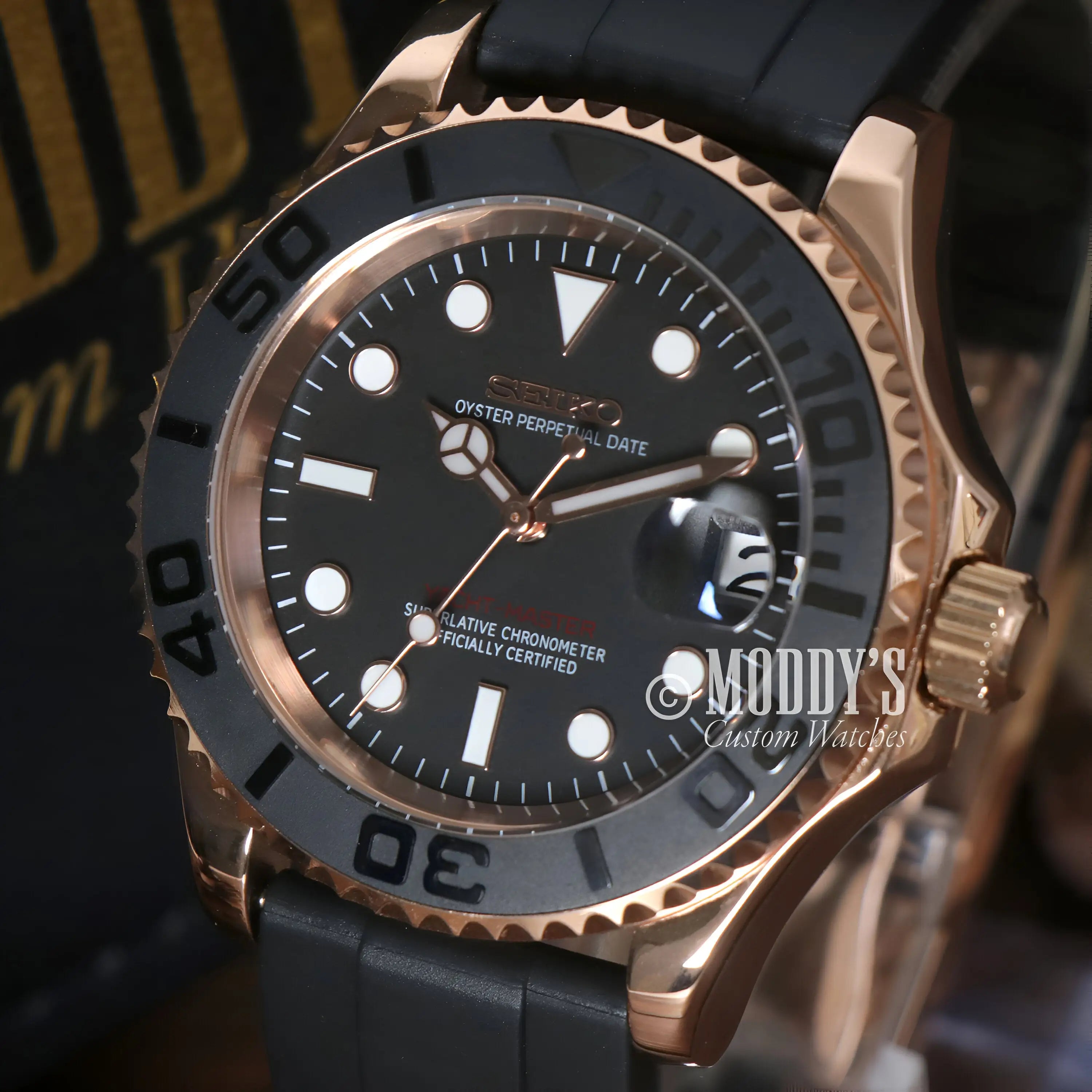 Rose gold and black Seiko mod Yacht-Master diver watch with rubber strap, water resistance, Seiko NH35 automatic movement
