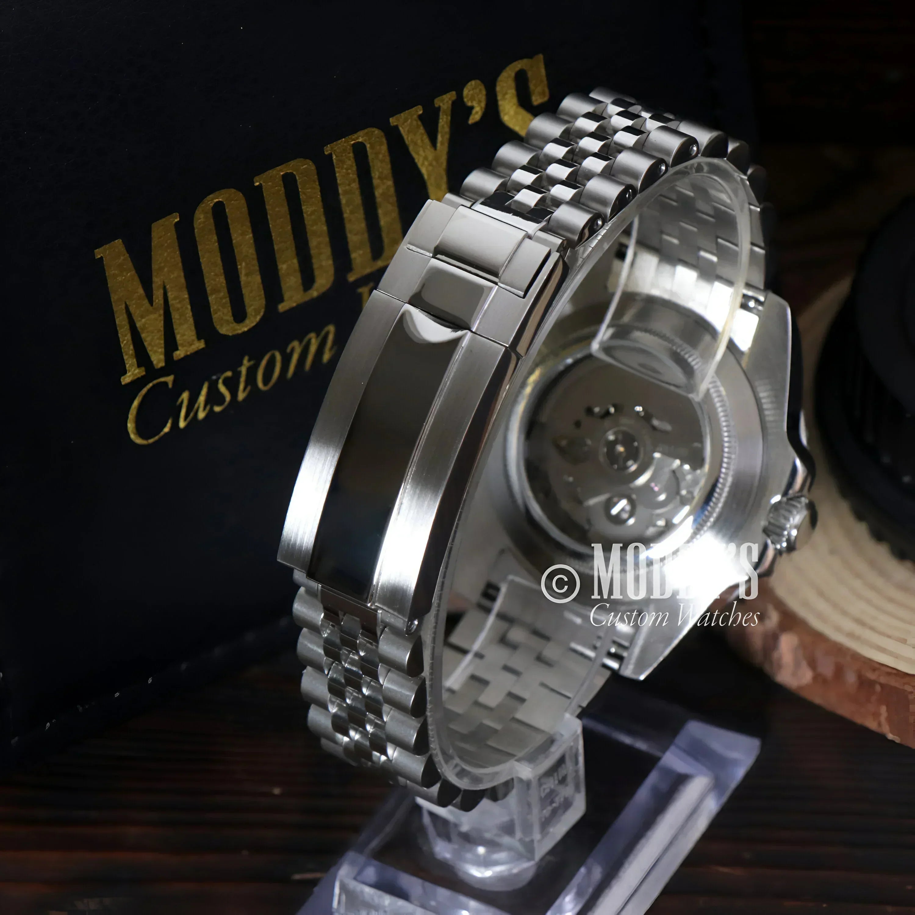 Silver wristwatch with metal band featuring NH34 automatic movement, GMTeiko Bruce Wayne
