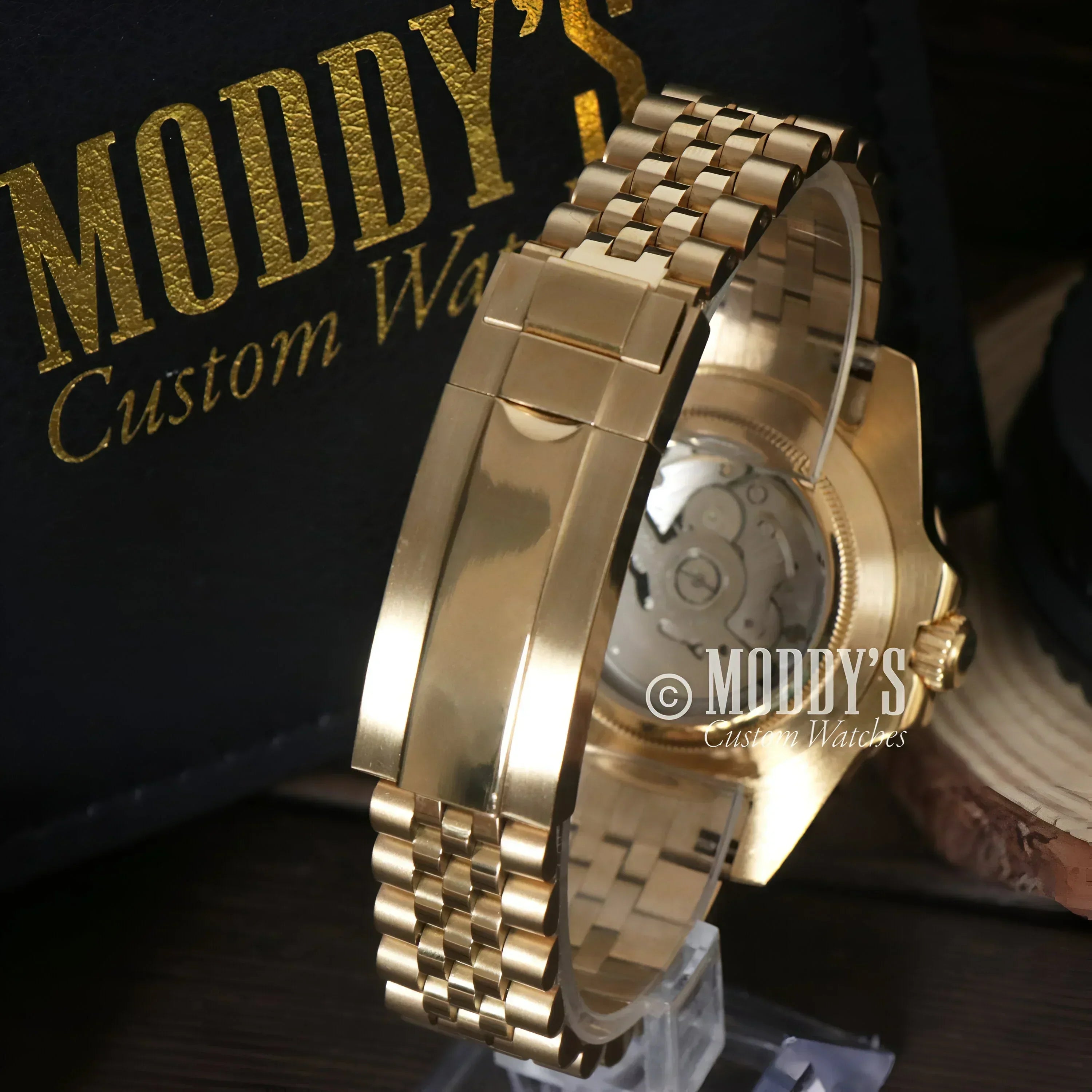 Gold-toned GMTeiko watch showcasing NH34 automatic movement and stylish design