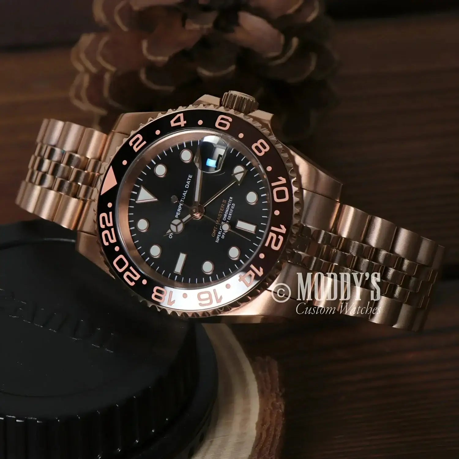 Rose gold wristwatch GMTeiko featuring Seiko NH34 automatic and elegant rose gold rootbeer design