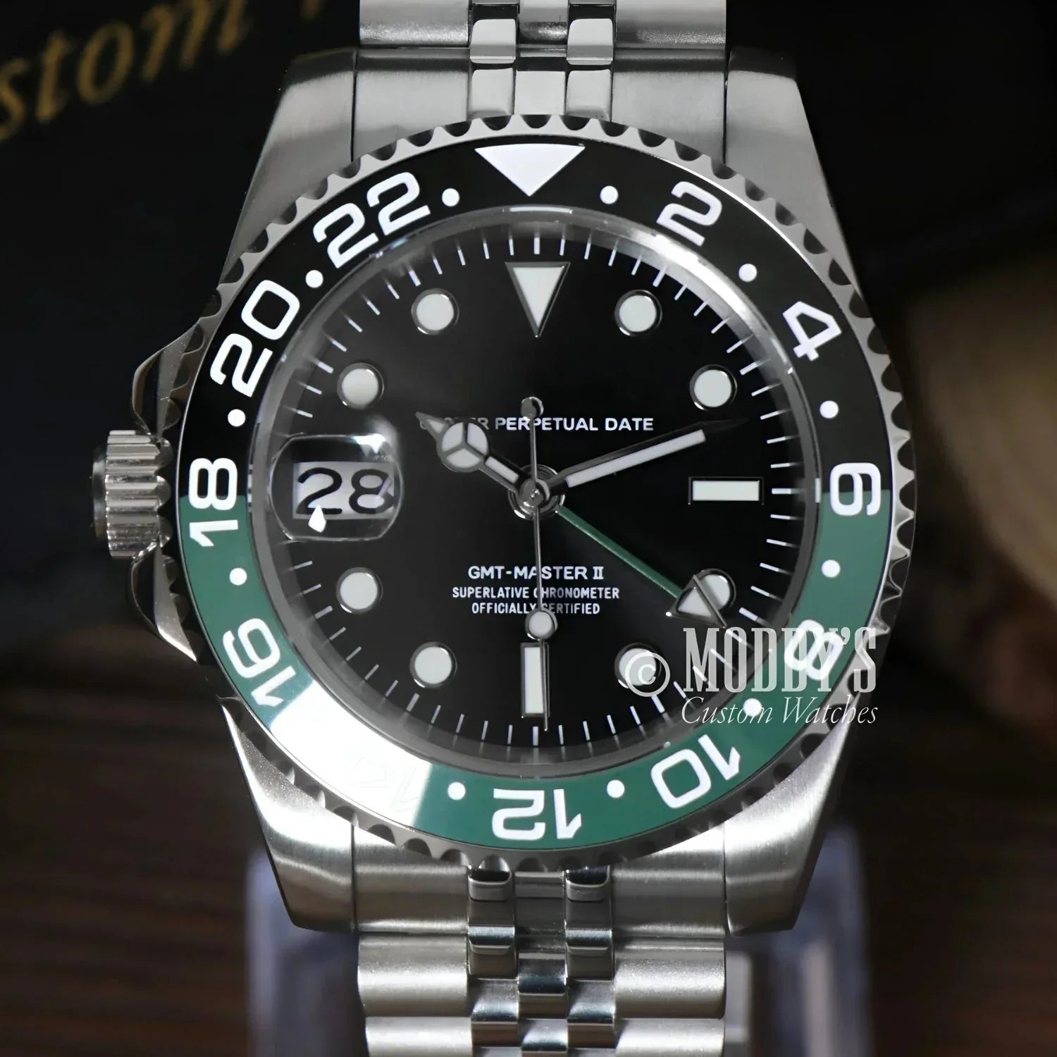 Green and black Rolex GMT-Master II watch featuring Seiko NH34 automatic movement