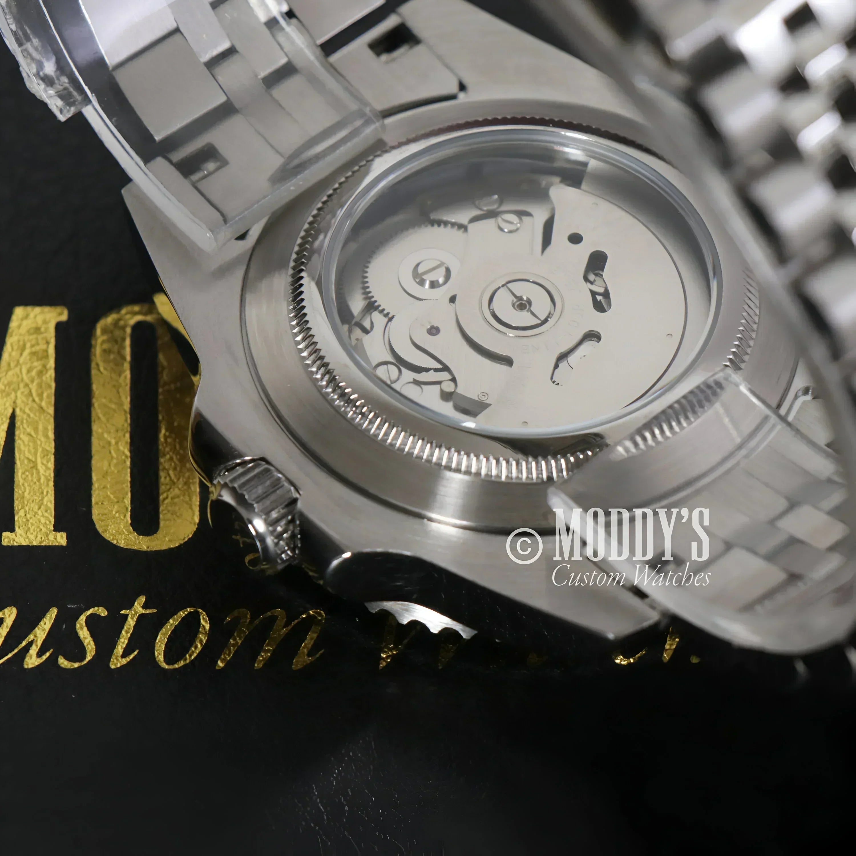 Silver wristwatch GMTeiko Sprite with Seiko NH34 automatic movement and exposed mechanics