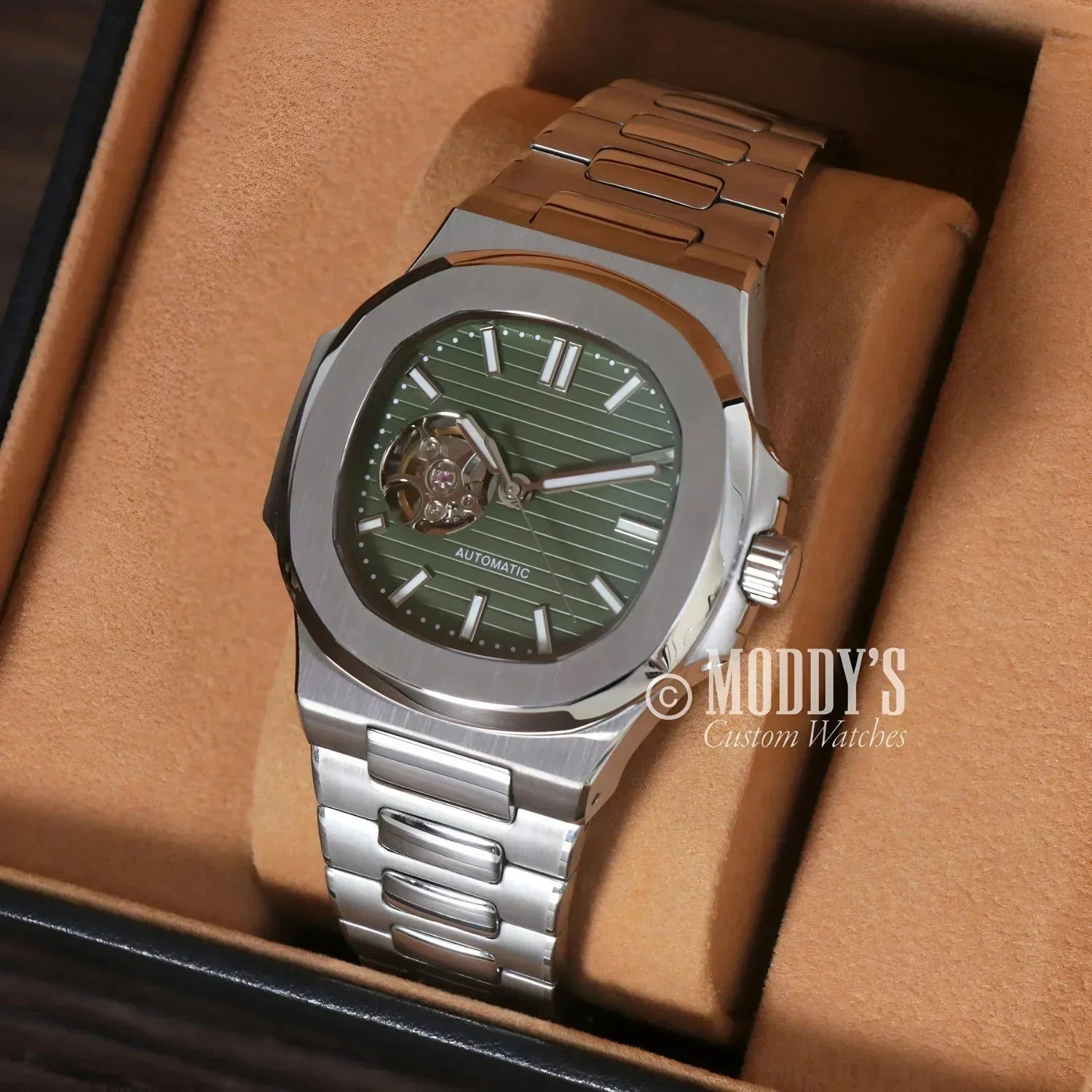 Silver automatic wristwatch featuring NH38 movement in Nautiko Green Open Movement design
