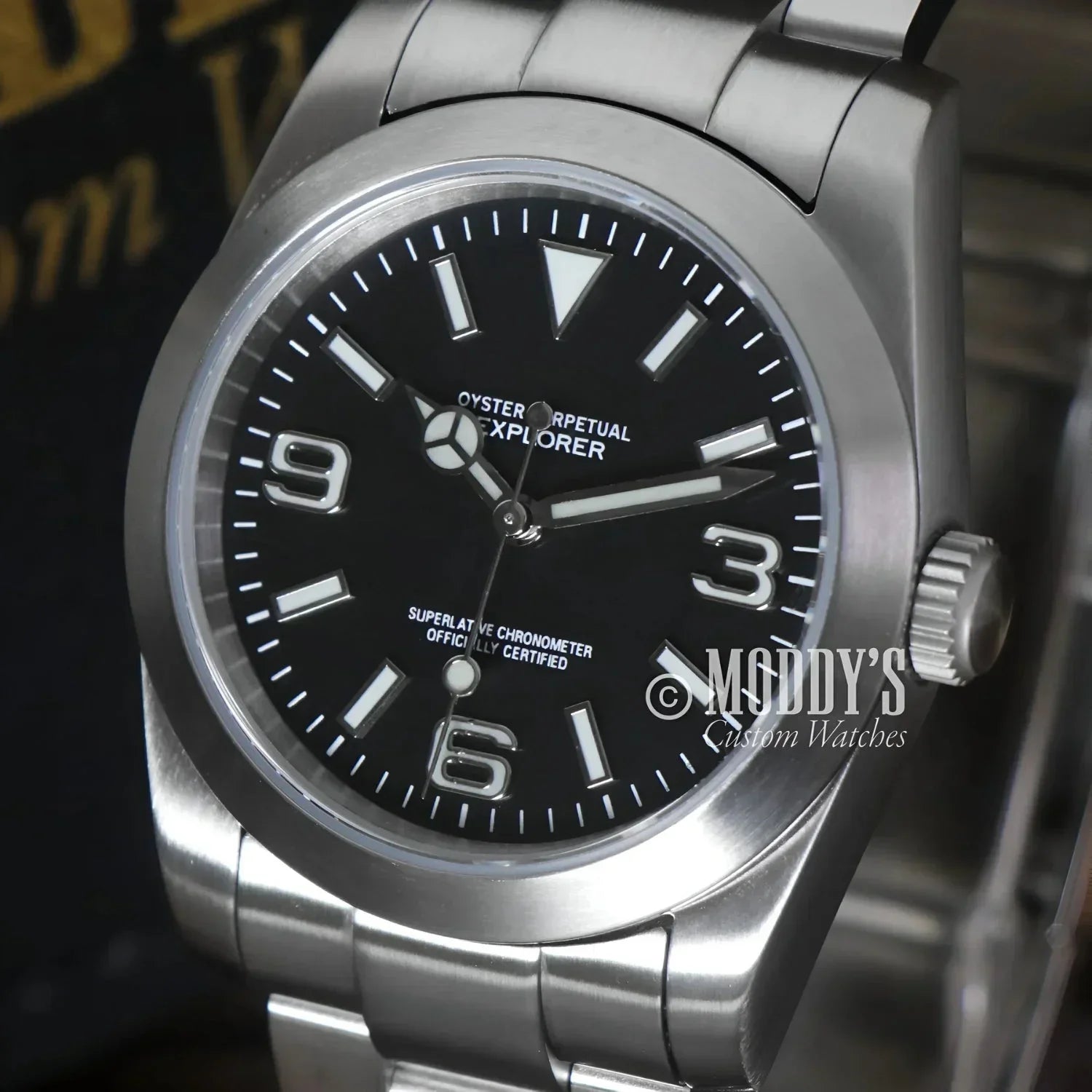 Silver wristwatch with black face featuring NH35 automatic movement from Oysteiko Explorer Black