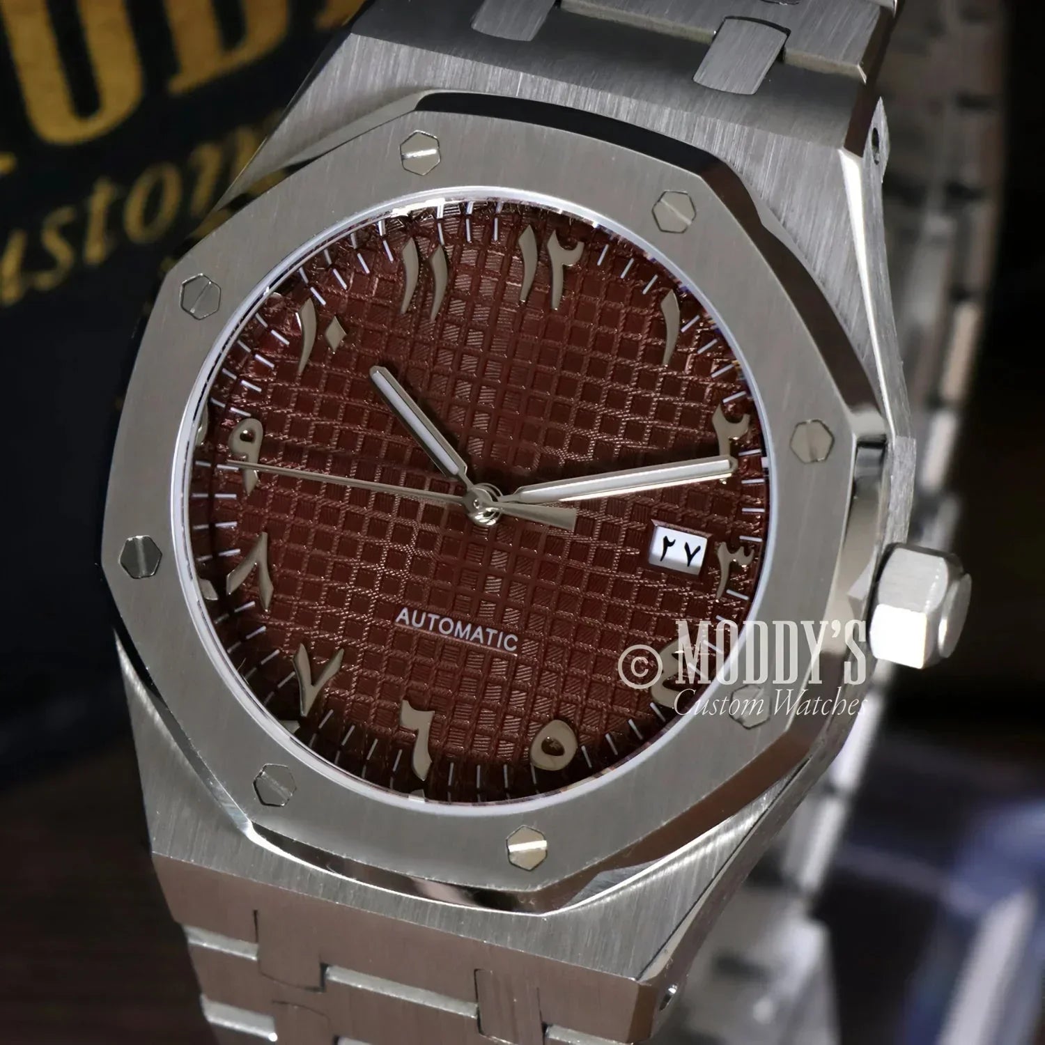 Silver wristwatch with brown patterned face, featuring NH35 automatic movement, Royal Seikoak