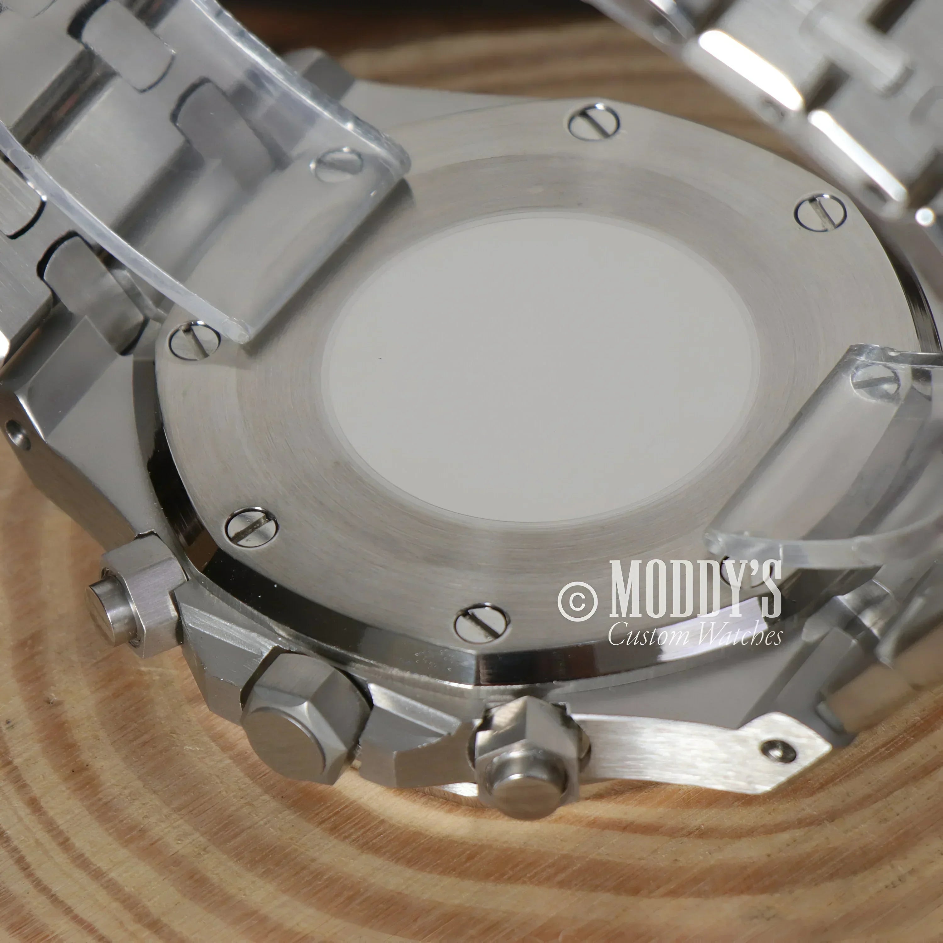 Silver wristwatch back of Royal Seikoak featuring VK63 hybrid movement