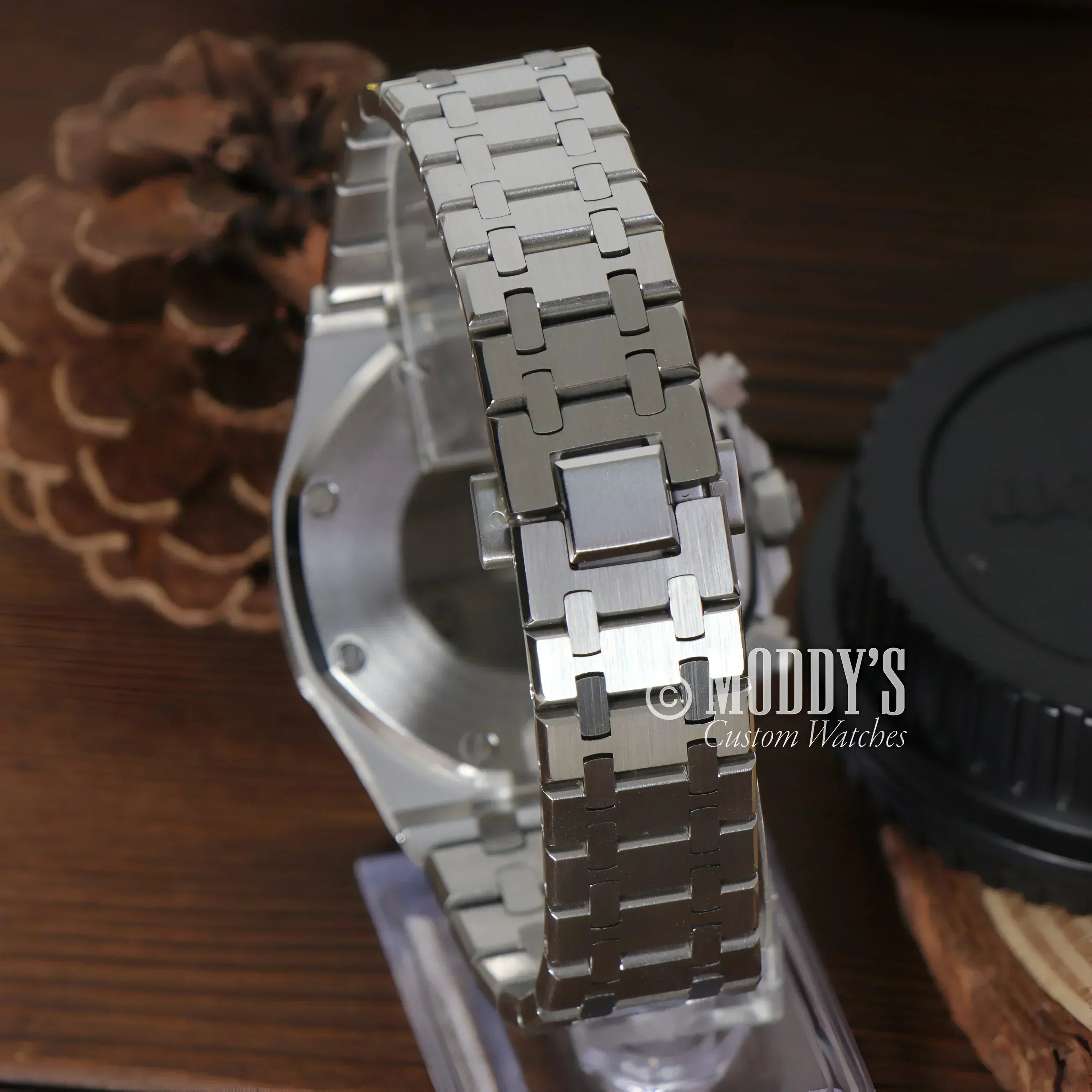 Silver metal watch from Royal Seikoak featuring VK63 hybrid movement design