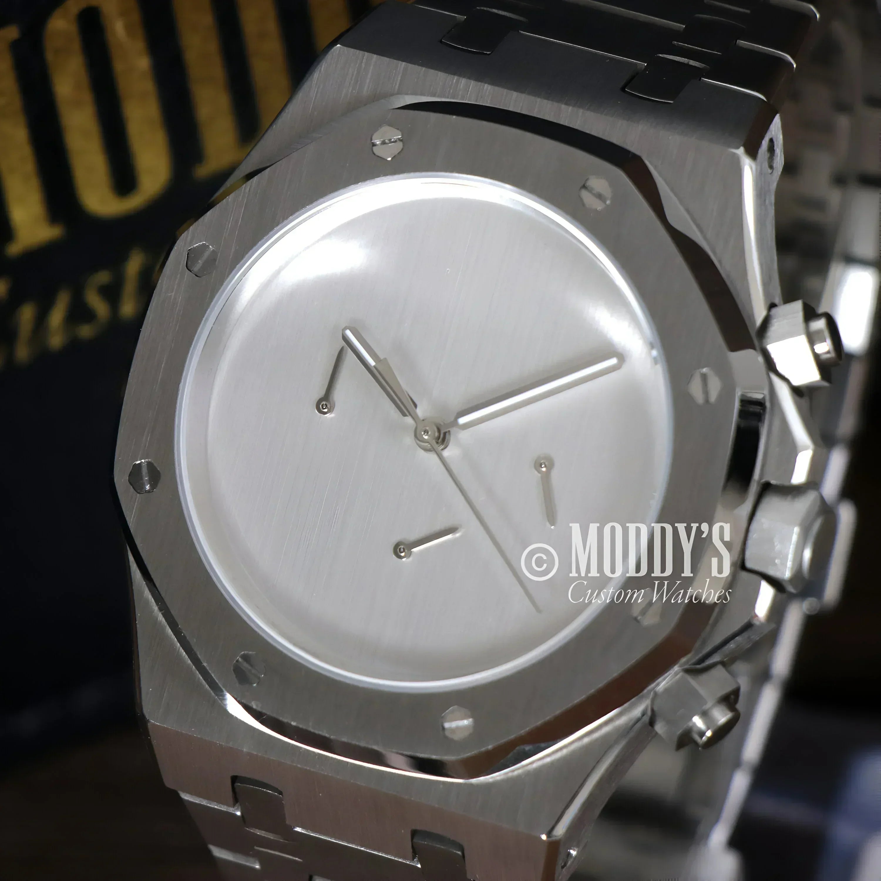 Silver wristwatch with minimalist face, Royal Seikoak features VK63 hybrid movement