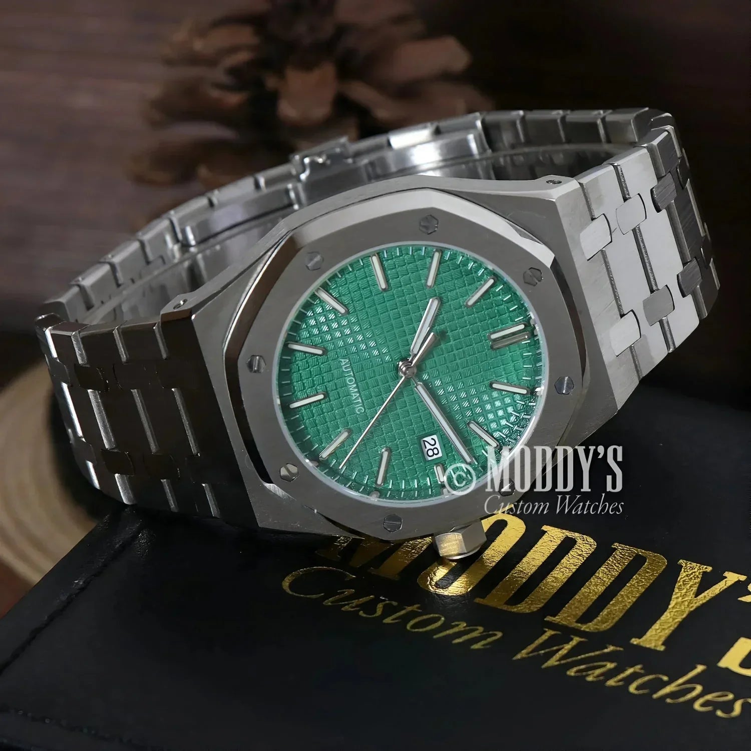 Silver watch with green face, Royal Seikoak featuring NH35 automatic movement