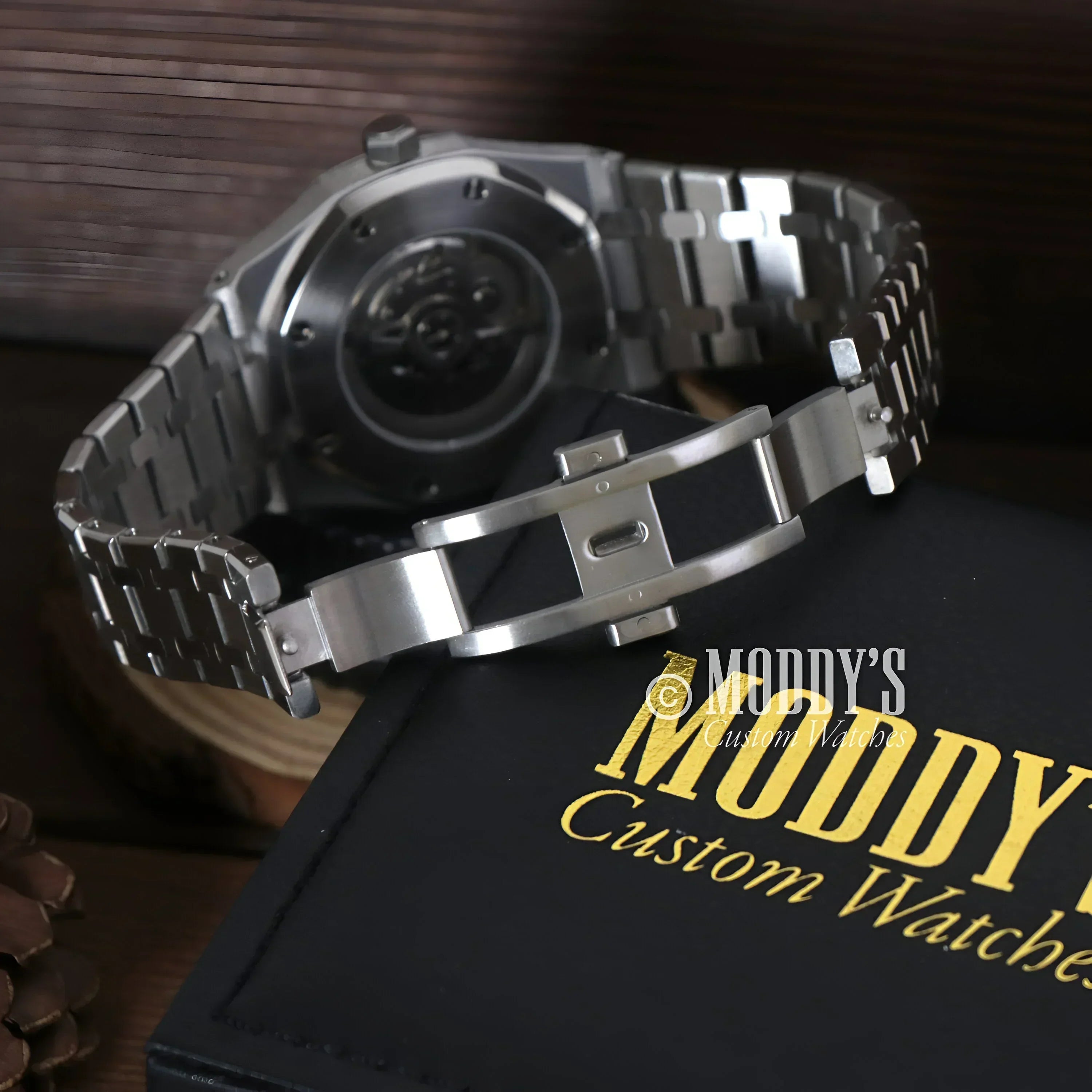 Silver wristwatch with deployment clasp from Royal Seikoak featuring NH35 automatic movement