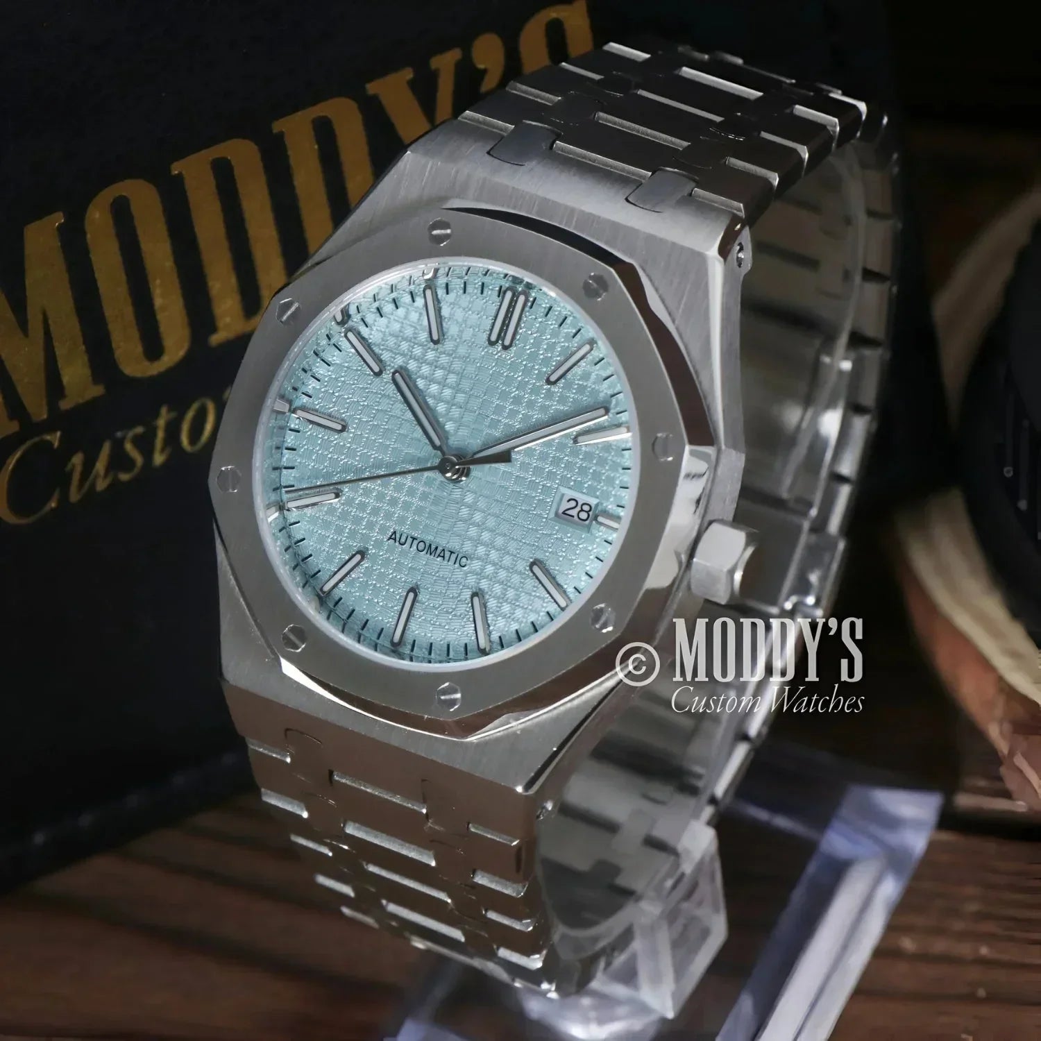 Silver-toned Seiko Mod Royal watch with light blue patterned face and NH35 automatic movement