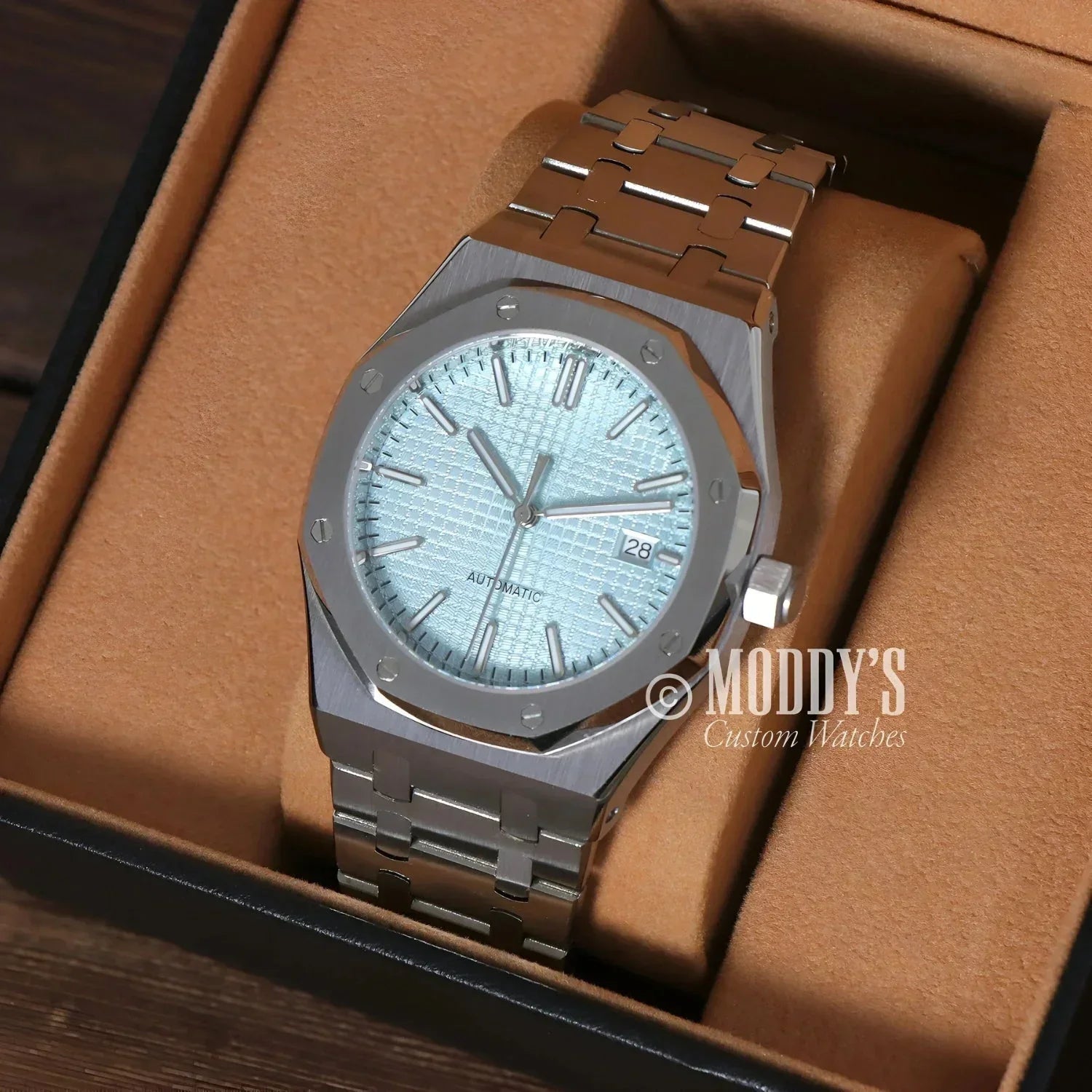 Silver automatic wristwatch with NH35 movement in Royal Seikoak Ice Blue design