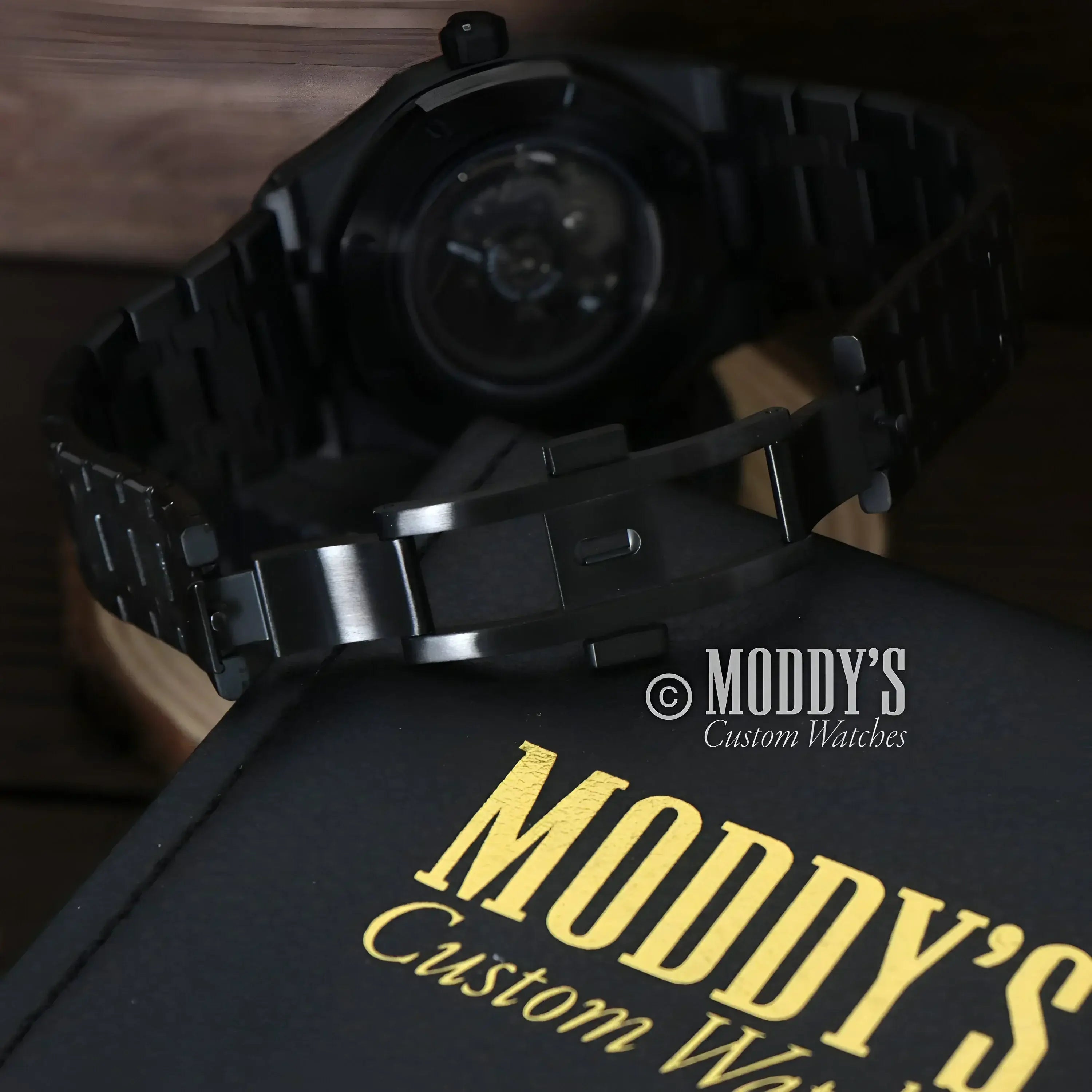 Black wristwatch with metal band from Royal Seikoak featuring Seiko NH72 automatic movement