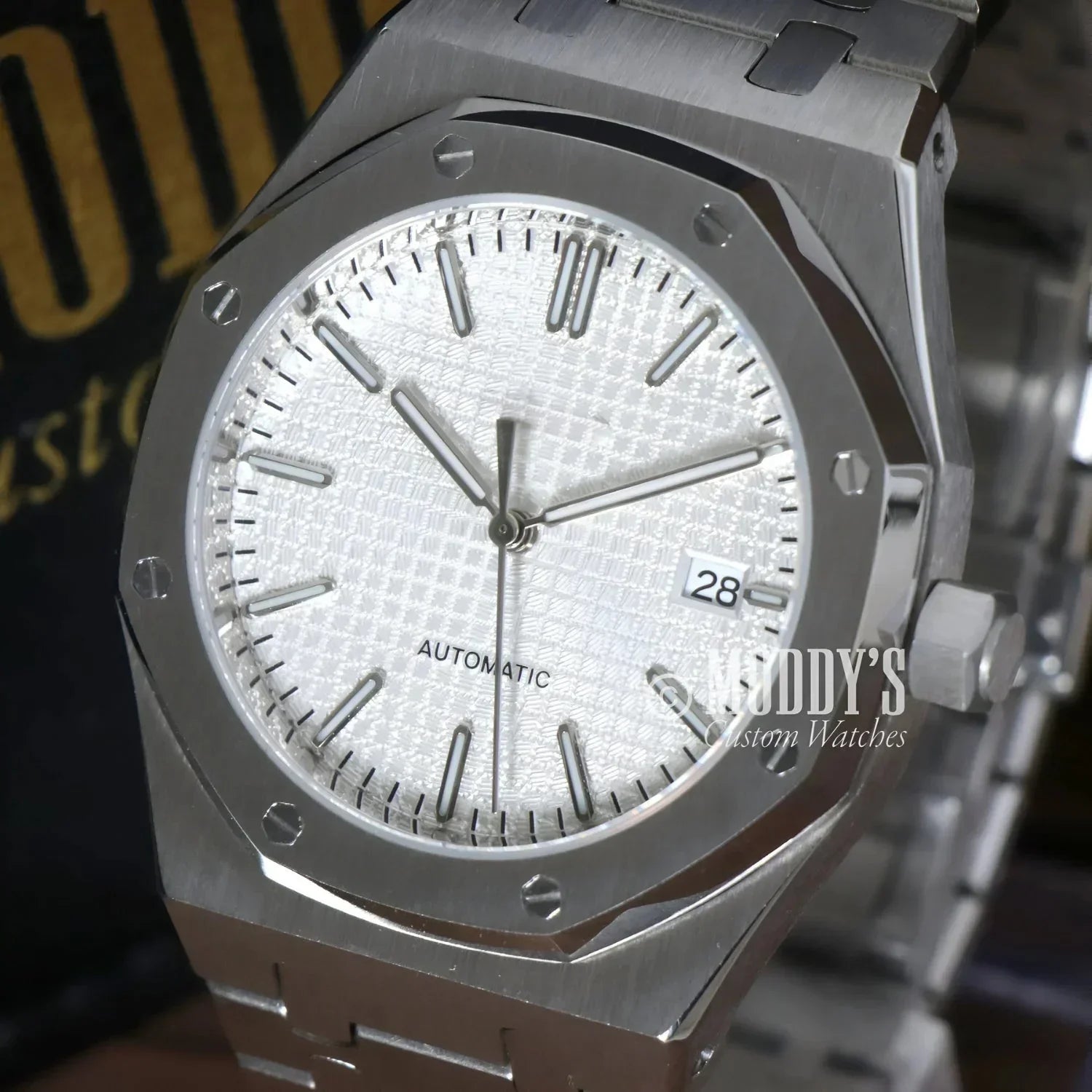 Silver wristwatch with octagonal bezel from Royal Seikoak features NH35 automatic movement