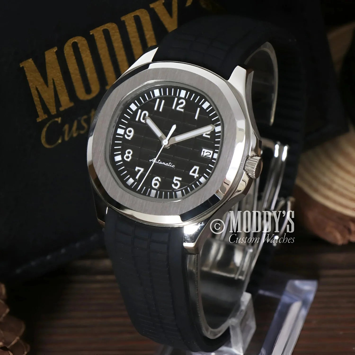 Silver wristwatch with black band featuring Seiko NH35 automatic movement