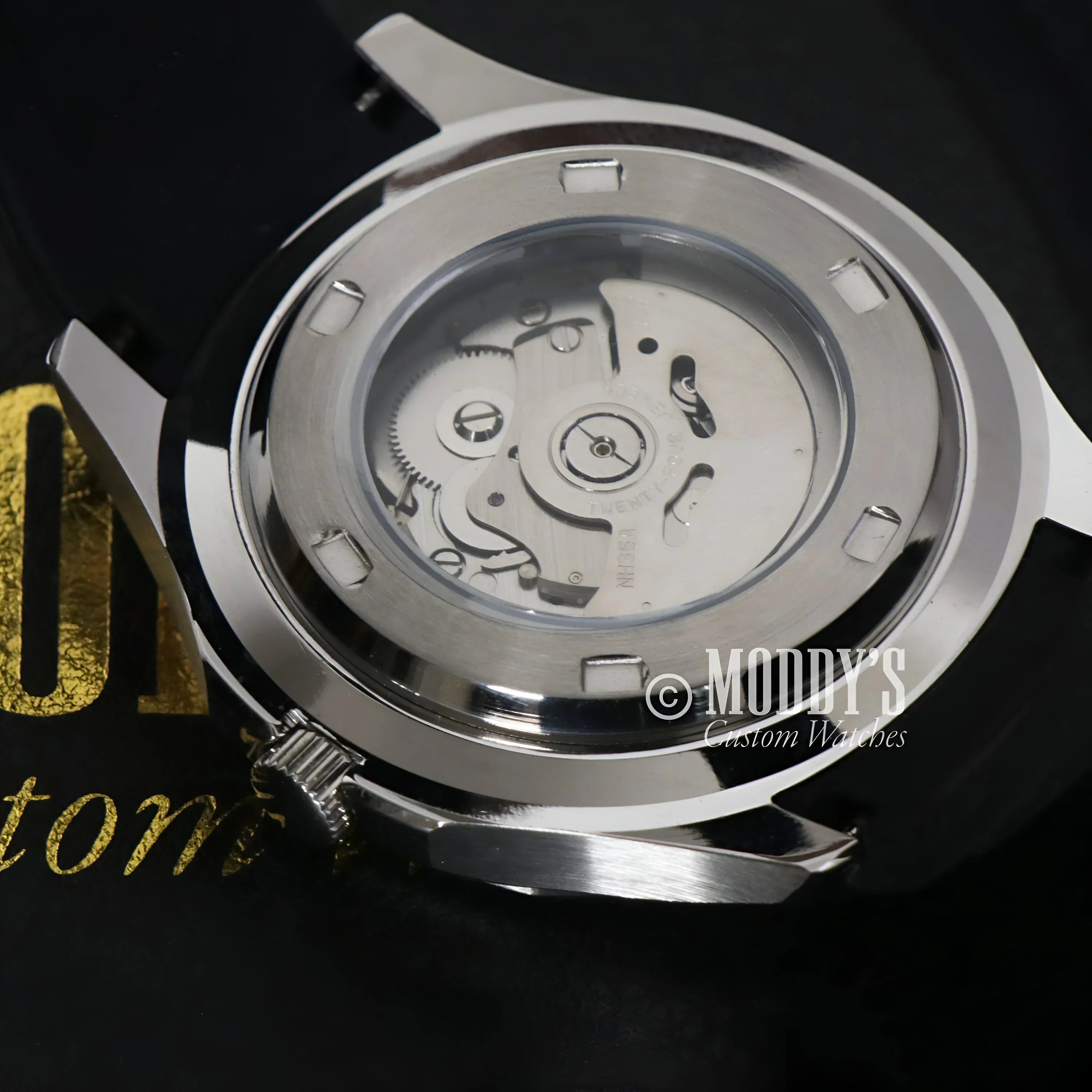 Silver watch case with visible NH35 automatic movement in Seikonaut Black model