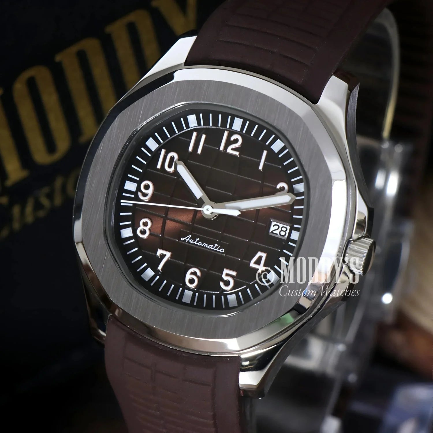 Silver Seikonaut wristwatch with brown band and NH35 automatic movement
