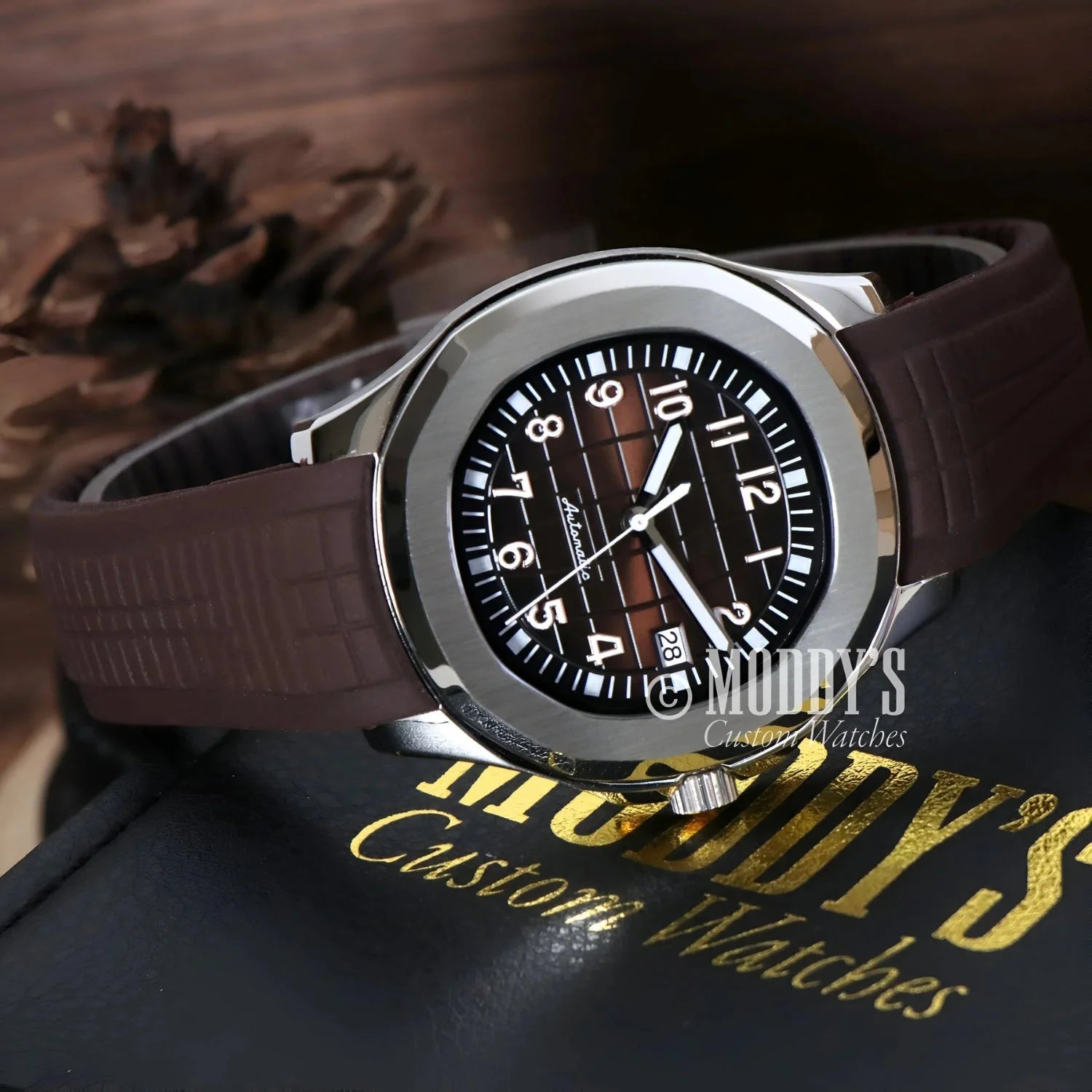 Silver Seikonaut watch with brown band features NH35 automatic movement for style and precision