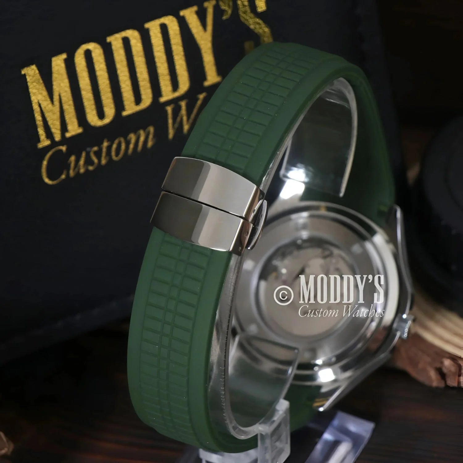 Green Seikonaut watch with silver clasp featuring NH35 automatic movement