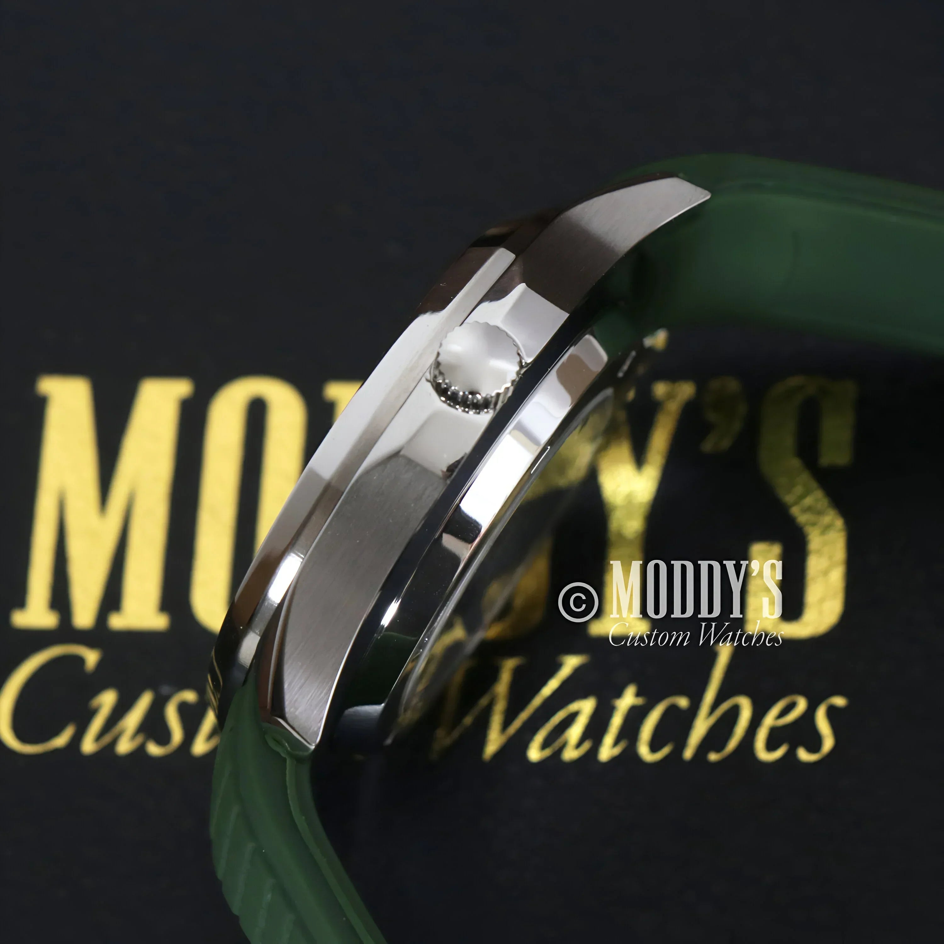 Silver wristwatch with a green band featuring Seiko NH35 automatic movement, Seikonaut model