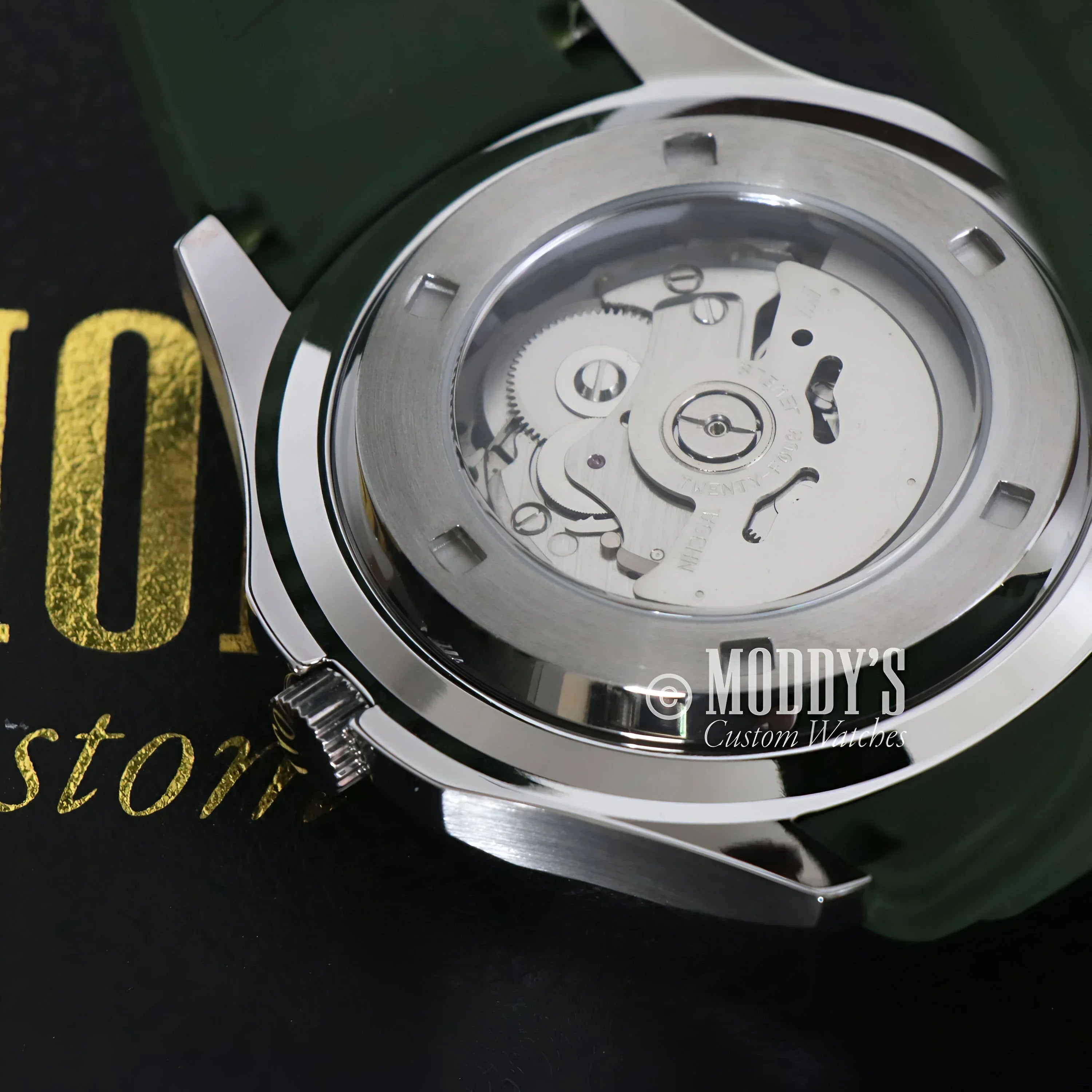 Silver wristwatch featuring visible gears, Seikonaut Green with NH35 automatic movement