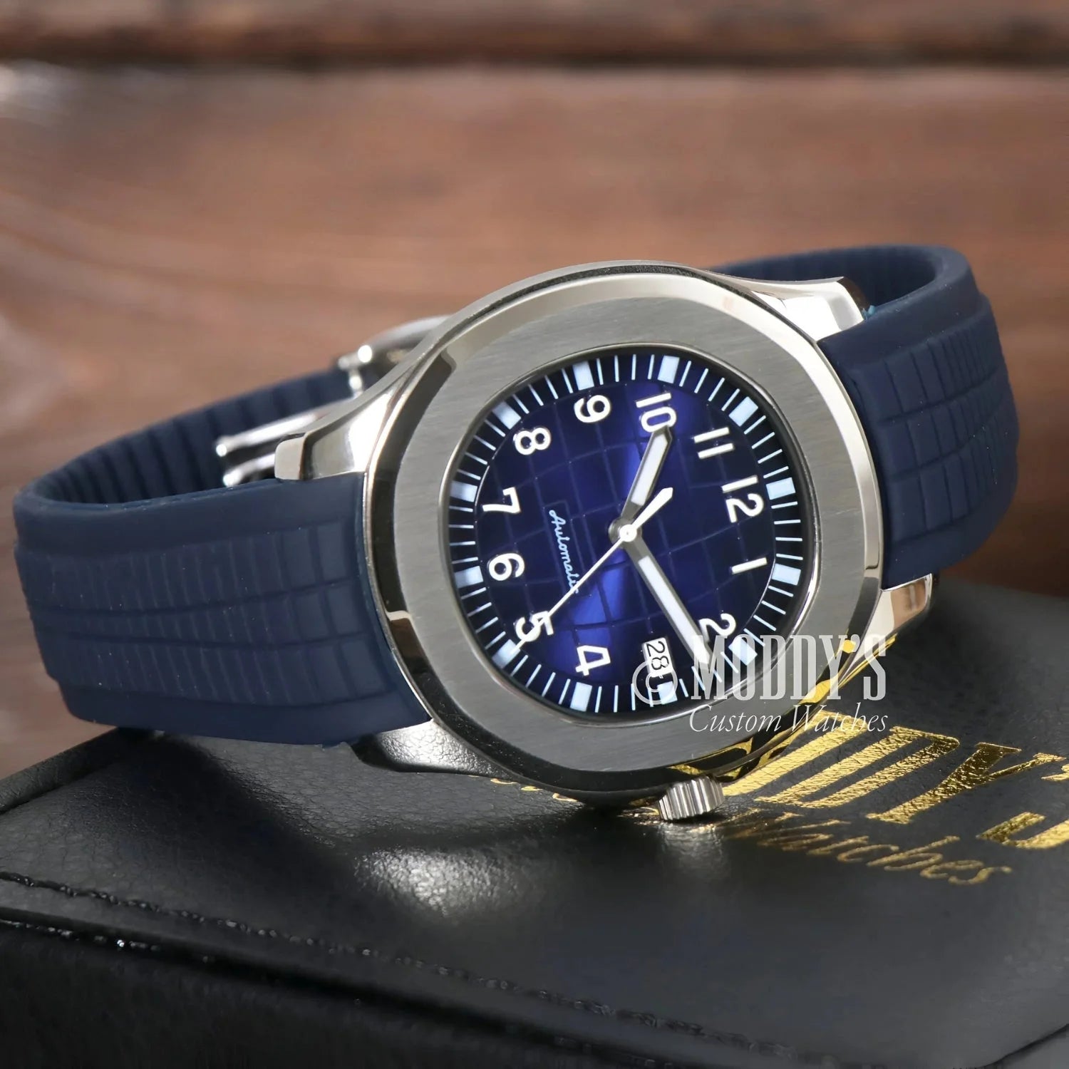 Silver wristwatch with blue face featuring Seiko NH35 automatic movement in Seikonaut